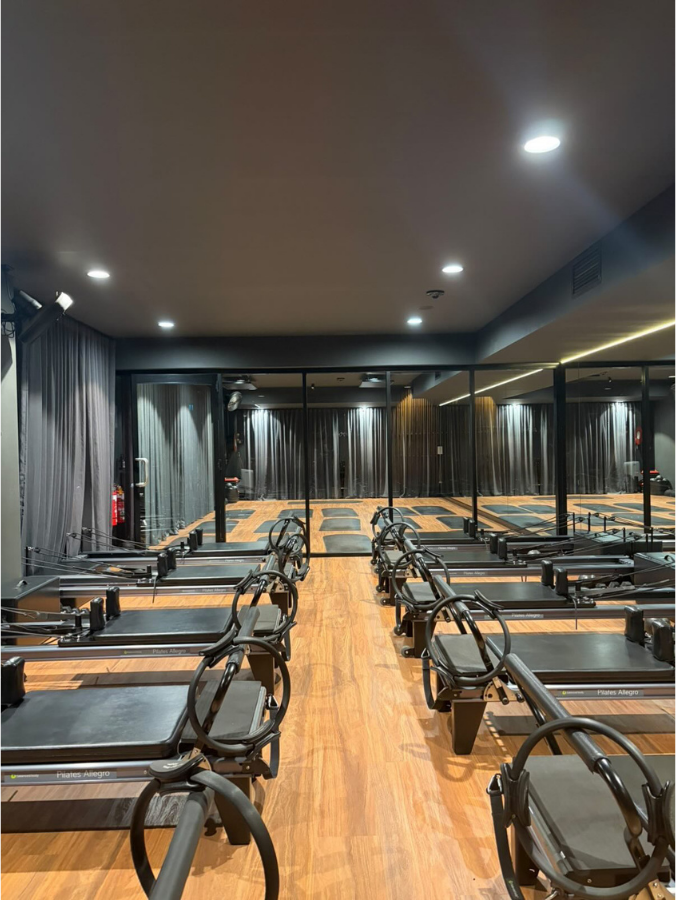 Reformer Pilates studio at You Wellness Club Palmyra with a row of reformers
