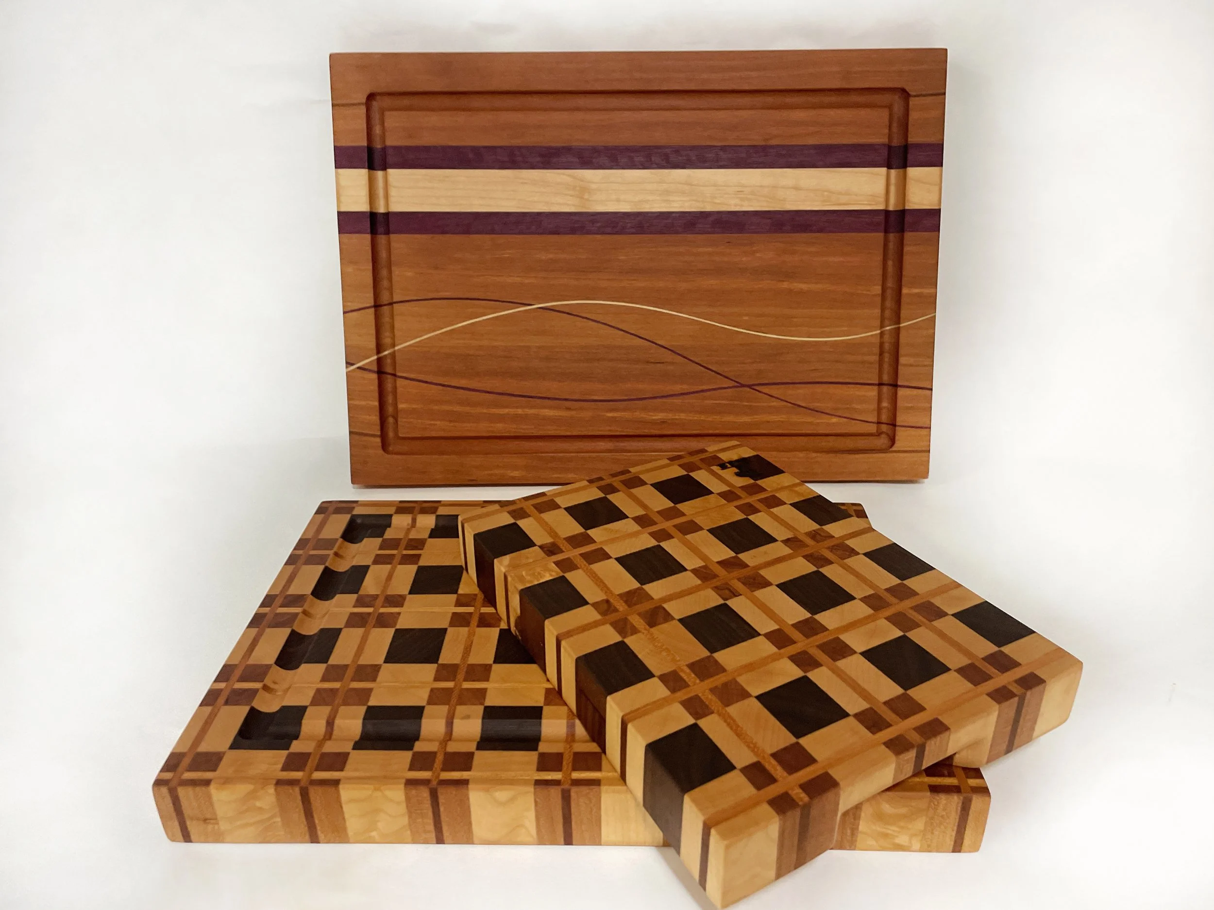 Arden Noble small cutting board with smooth finished surface and refined plaid hardwood design