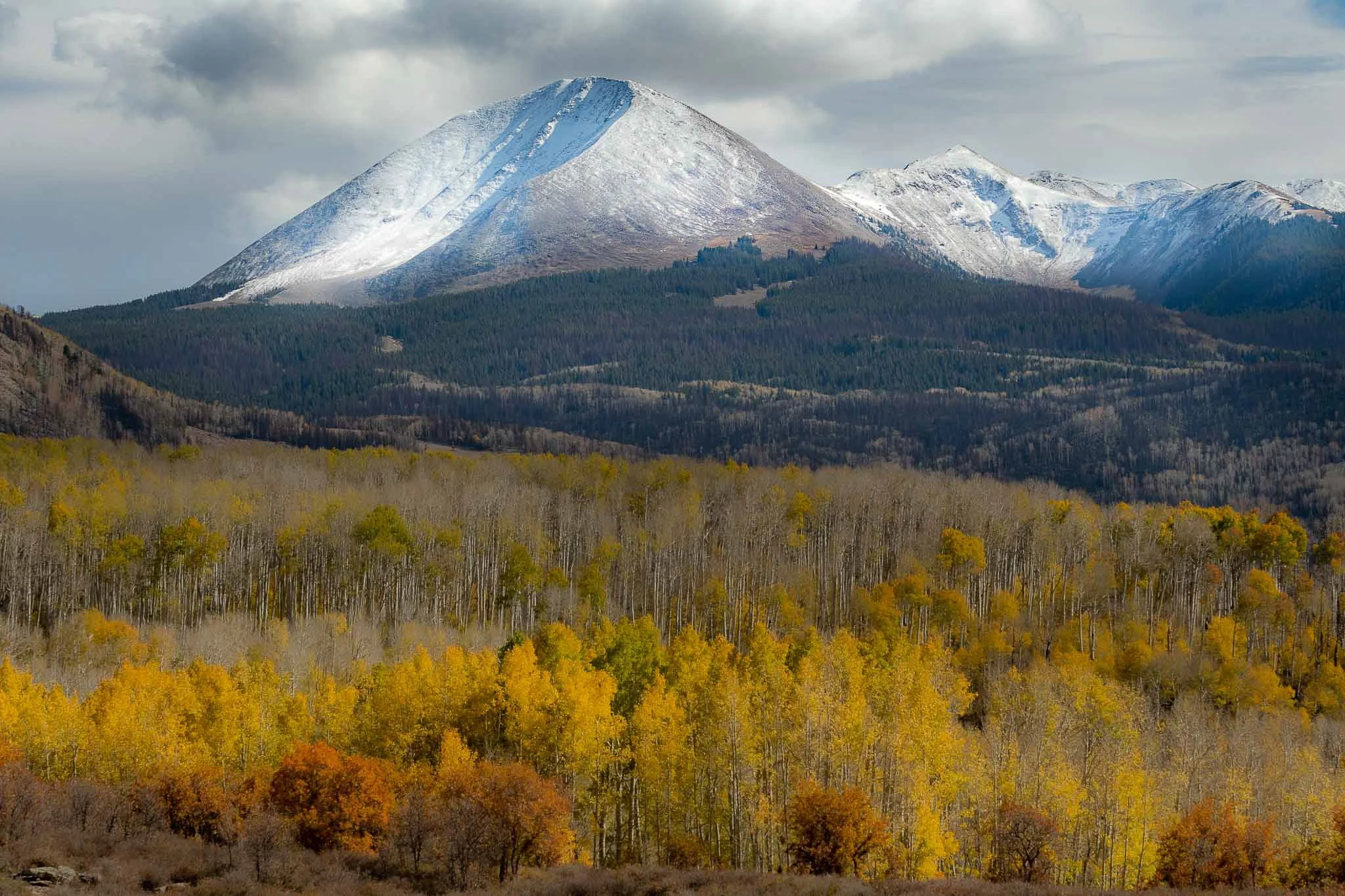 Mount Mellenthin — First Snow on Fall Leaves
La Sal Mountains — Moab, Utah
The first snow of the season caps Mount Mellenthin while autumn still burns gold across the aspen-covered slopes below—a fleeting meeting of fall and winter.
Limited Edition •
