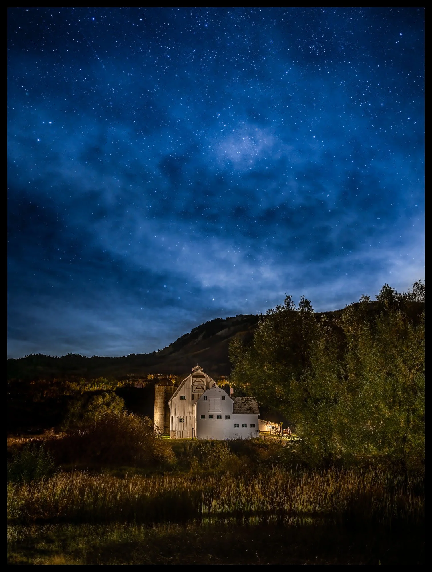 McPolin Starry Starry Night
McPolin Barn — Park City, Utah

Under a brilliant canopy of stars, the familiar white barn takes on a different character—timeless, solitary, and surrounded by the wonder of the night.

Limited Edition • Signed & Numbered.