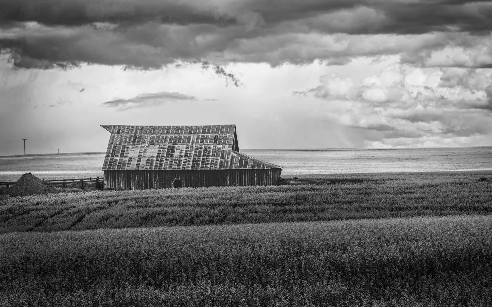 Lost in Time
(_DSC8206)
Bear River Valley — Northern Utah  
An abandoned barn slowly surrenders to time beneath the changing skies of the Bear River Valley—a weathered reminder of the farms and families that shaped rural Utah.
Limited Edition • Signe