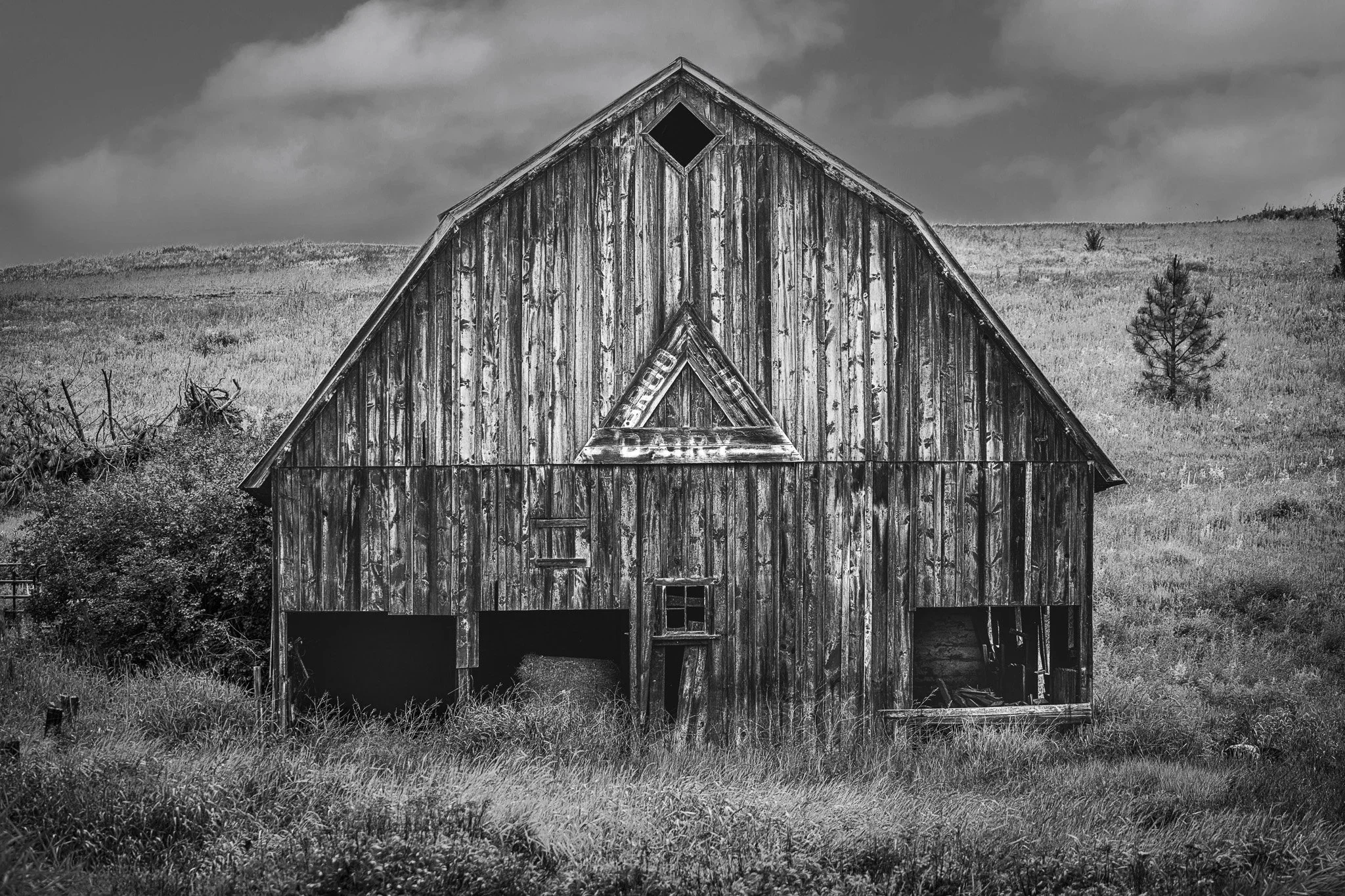 Brooks Dairy Farm
(_DSC8375)
Near Colfax — Palouse, Washington  
The faded Brooks Dairy sign remains on a weathered barn slowly surrendering to time—a quiet reminder of the family farms that helped shape the American West.
Limited Edition • Signed & 