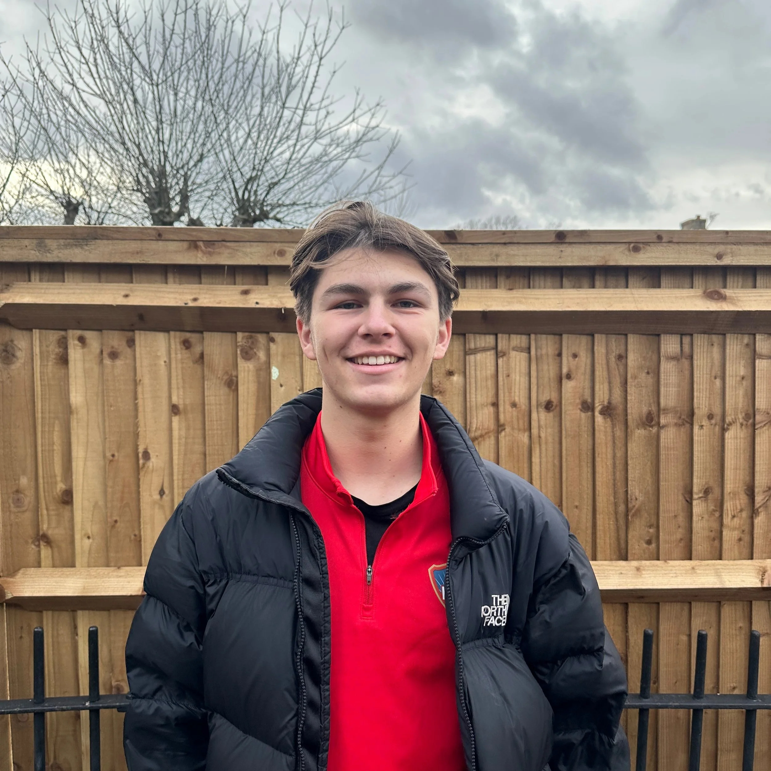 Silhouette of a person's head and shoulders in gray.