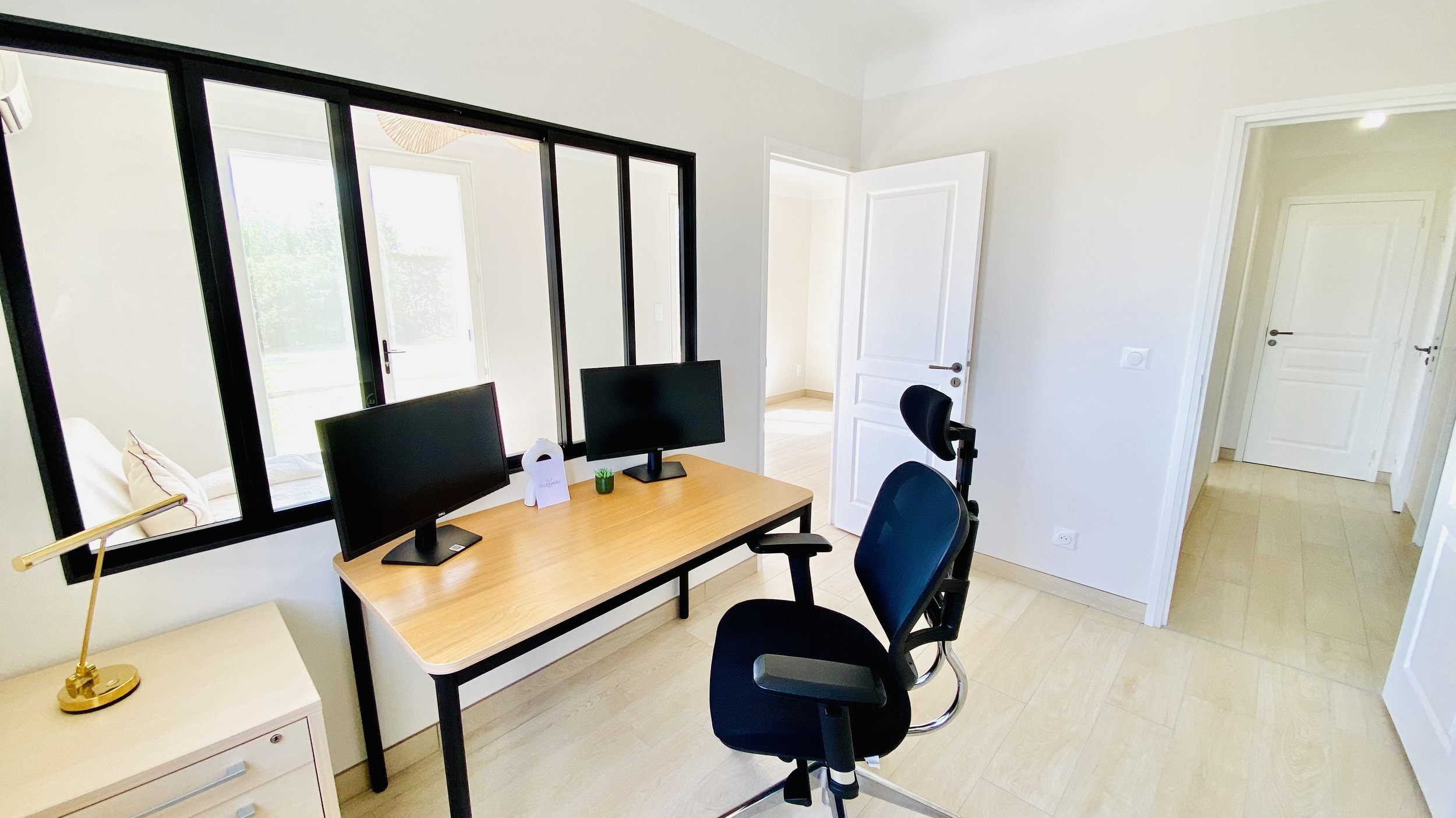 Home office workspace with desk and natural light inside Villa Magali Arles