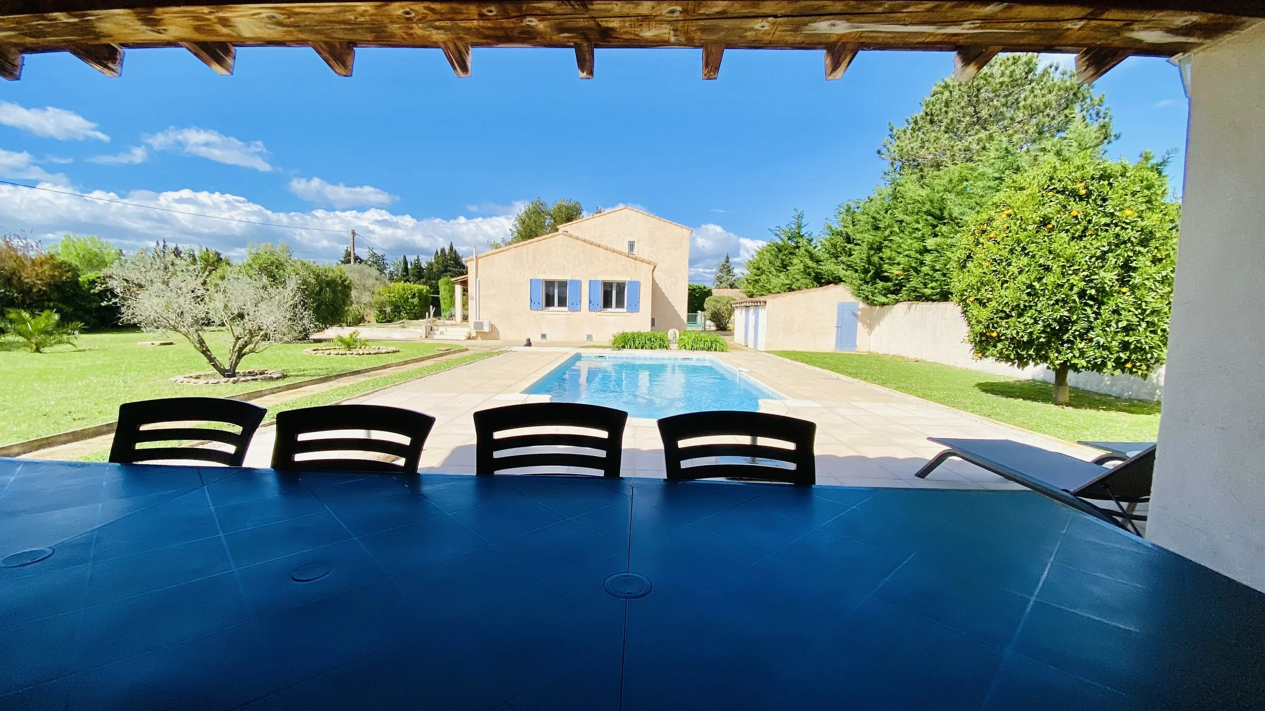 Pool terrace with outdoor dining area at Villa Magali Arles Provence holiday villa