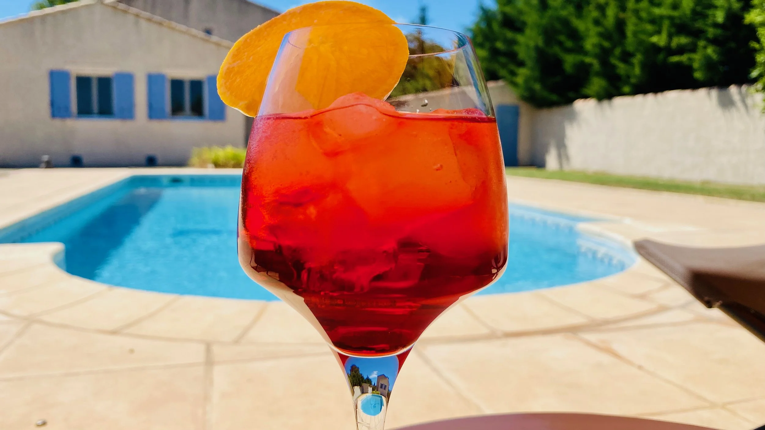 Poolside aperitif with spritz cocktails at Villa Magali Arles Provence vacation villa