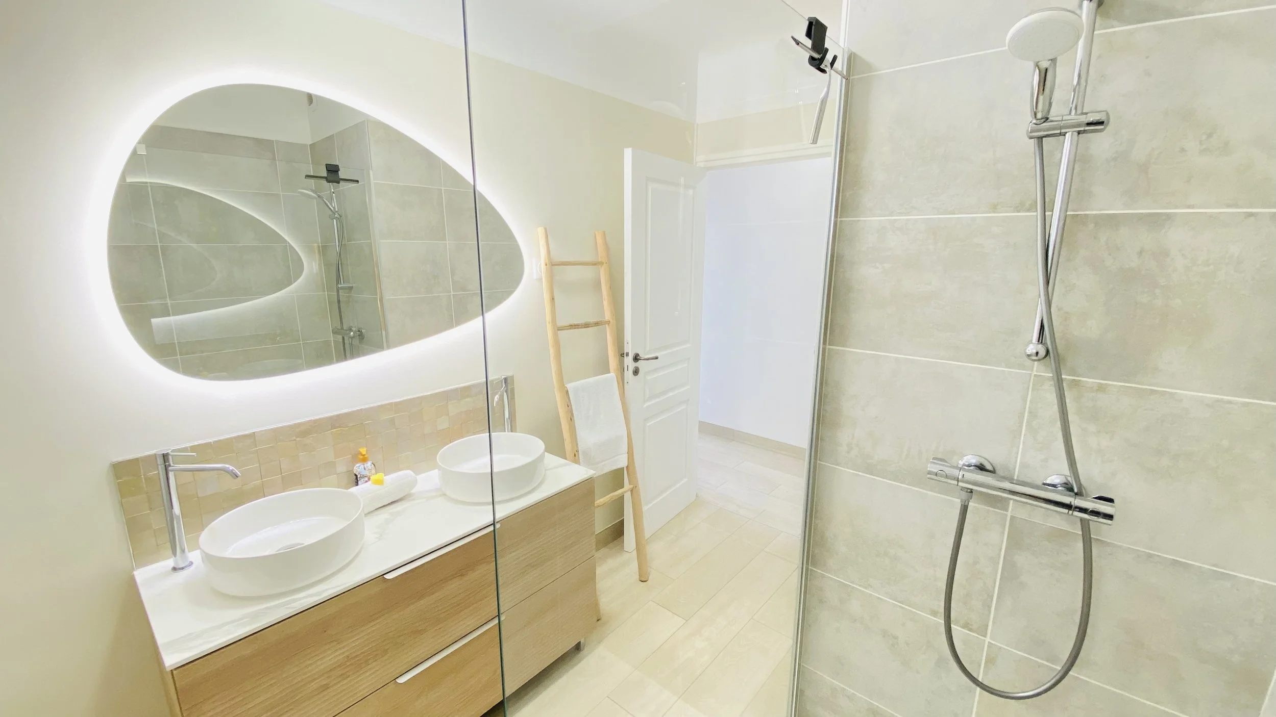 Modern bathroom with walk-in shower and double sink vanity at Villa Magali Arles