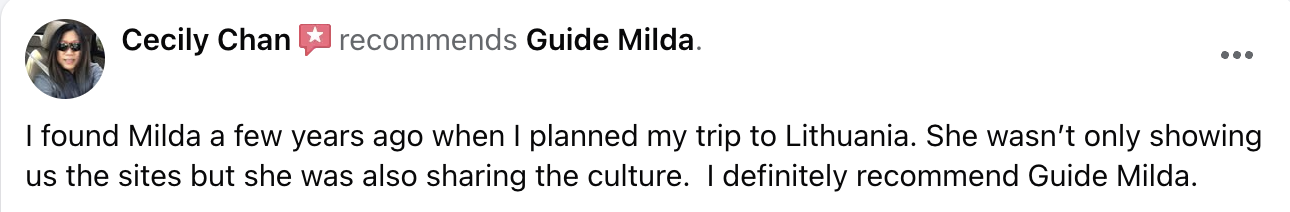 A woman with long dark hair wearing sunglasses and a dark jacket.