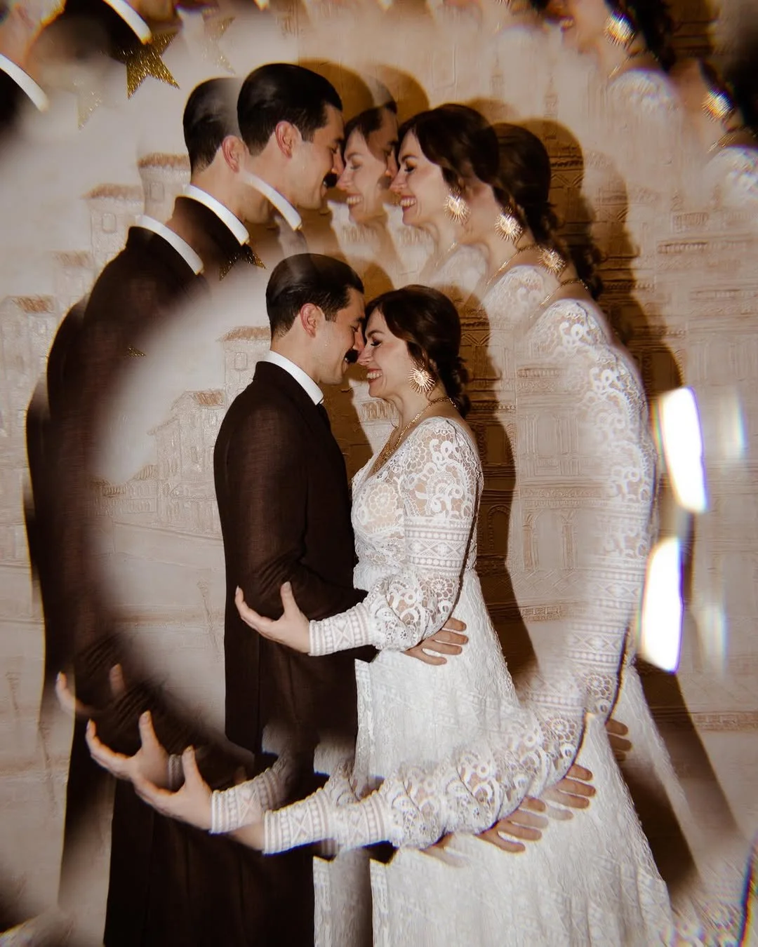 A wedding couple stands close, happily smiling, with a layered, swirling effect showing multiple images of their faces and bodies overlapping each other in a romantic pose.