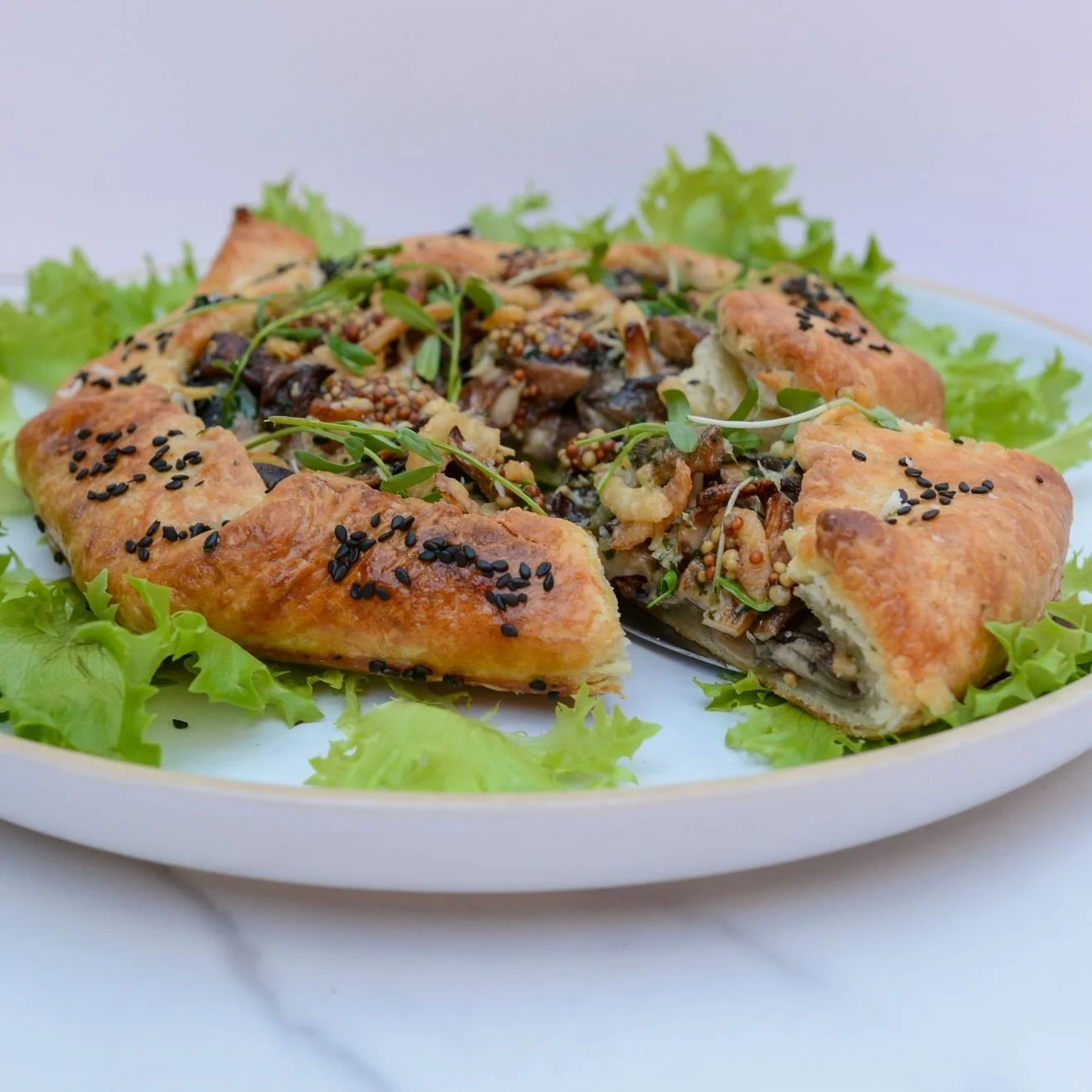 Sharing is caring! 💞⁠
⁠
This feature is perfect for a light entree or appetizer for two!⁠
⁠
This crostata is a true taste of winter. Roasted mixed mushrooms with sweet onions &amp; creamy gruyere cheese sauce. All you have to do is warm the crostata