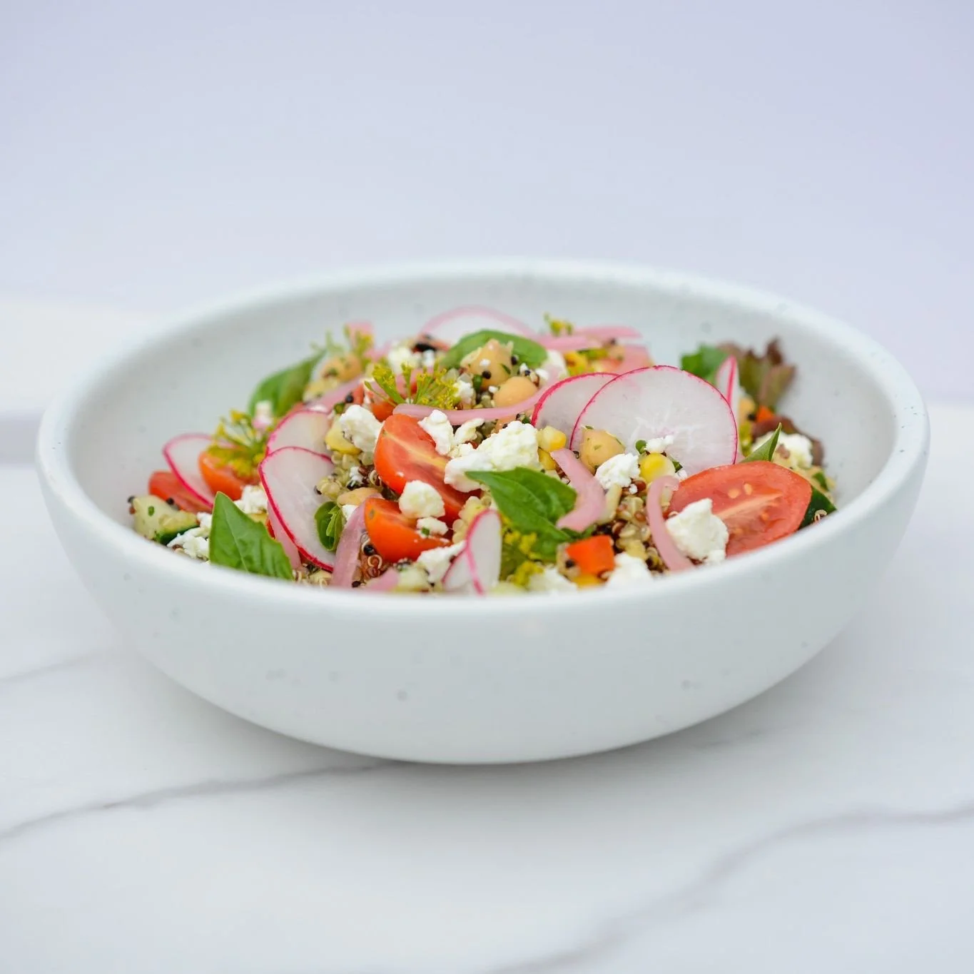 Fresh, veggie-packed, and loaded with protein, your perfect grab-and-go meal is here.⁠
⁠
This week&rsquo;s feature salad is filled with tomatoes, cucumber, peppers, corn, and chickpeas, then topped with pickled red onion, goat cheese, and finished wi