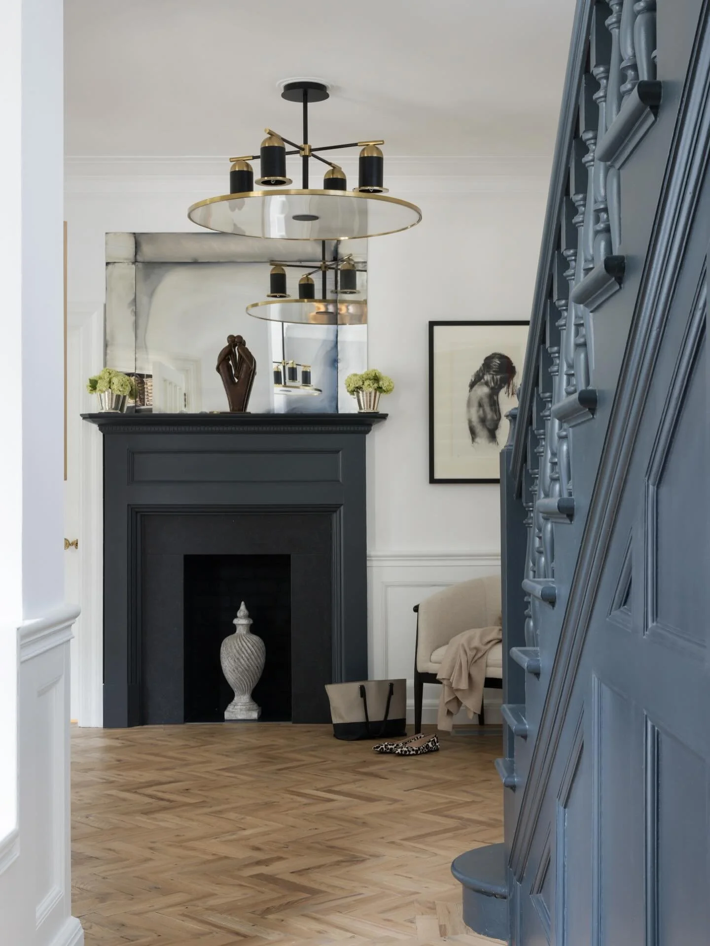 A wider view of this beautiful hallway. 

When I first stepped foot in here it had been very recently decorated by another interior designer. But there was one major thing that I felt had to change for practical reasons - we replaced the carpet with 