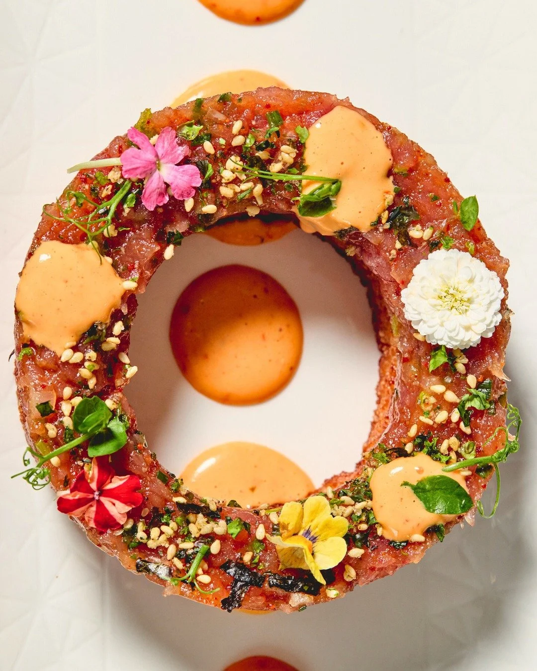 Tuna Tartare with sesame, jalape&ntilde;o, crispy rice, &amp; rose harissa.

📸 @briansamuelsphotography