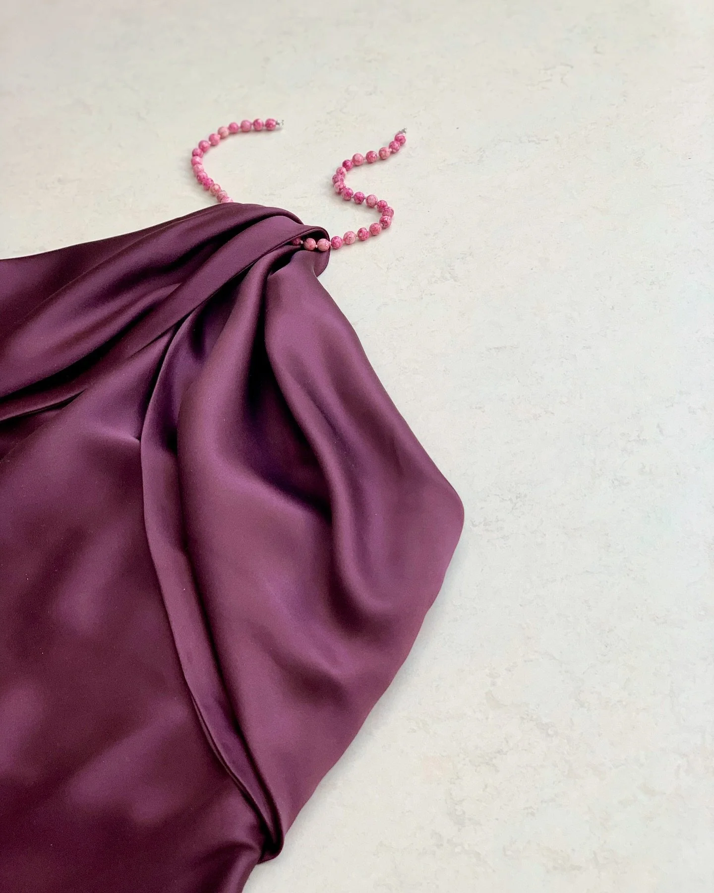 draped silk dress with necklace