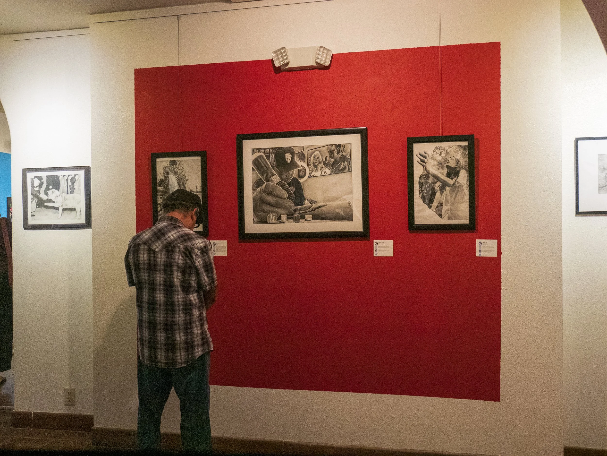 Viewer inside main gallery during opening reception for Fullerton Joint Union High School District Student Art Show.jpg
