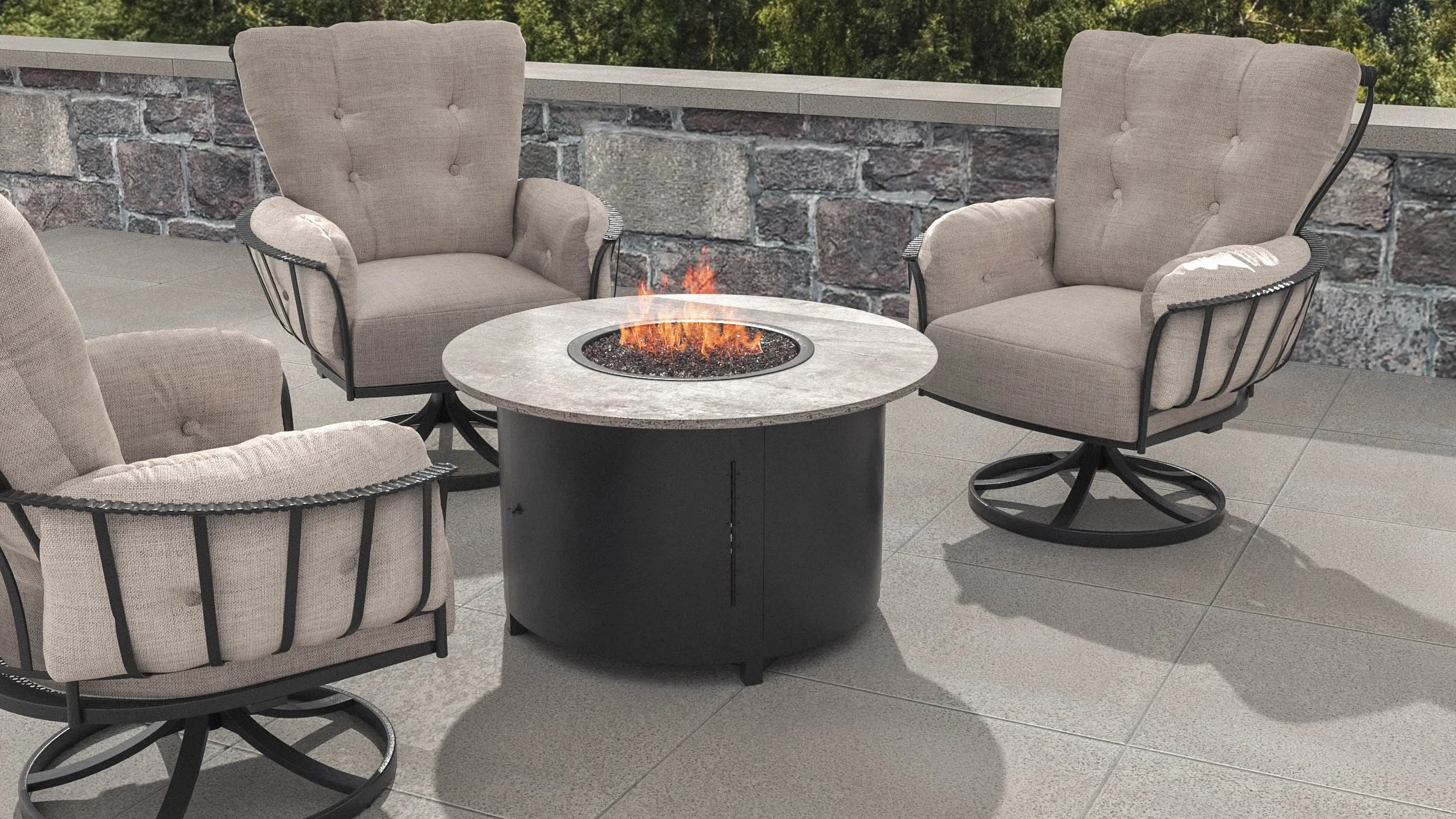 grey cushion chairs surrounding an outdoor fireplace
