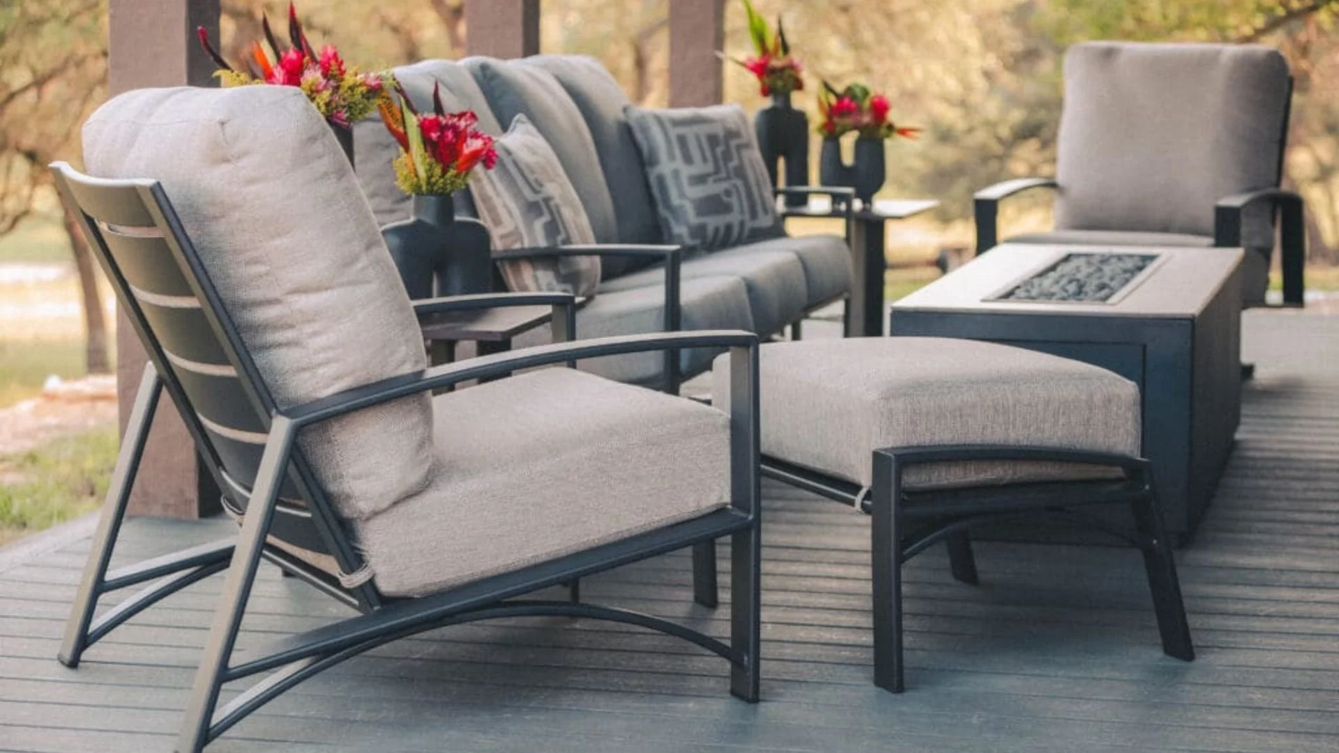 grey patio furniture with red flower accents
