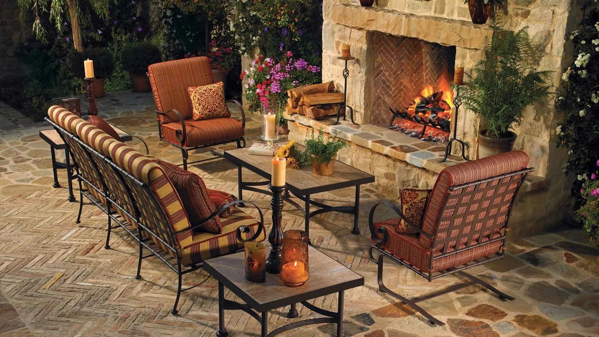 elegant furniture outside near a stone fireplace
