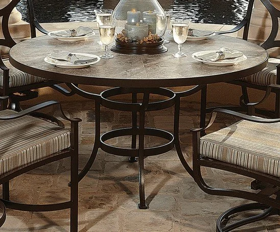 dark table set with plates and wine glasses