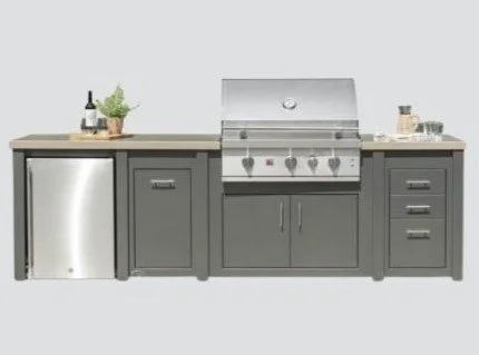 outdoor kitchen with gray finishing and a fridge