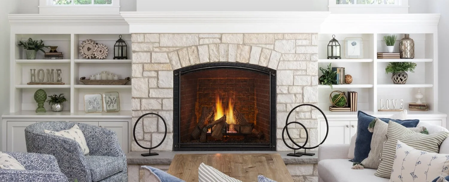 gas fireplace insert in a modern, organized living room with white brick surround