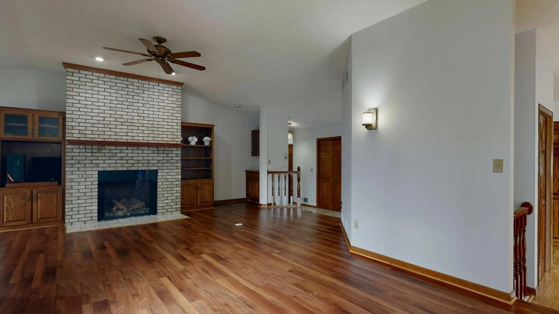 winter fireplace effciency michigan open floor living room wood floors and ceiling fan mid 2000's house