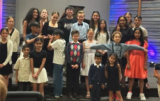 Group photo of piano teacher and piano students after the June 2025 recital