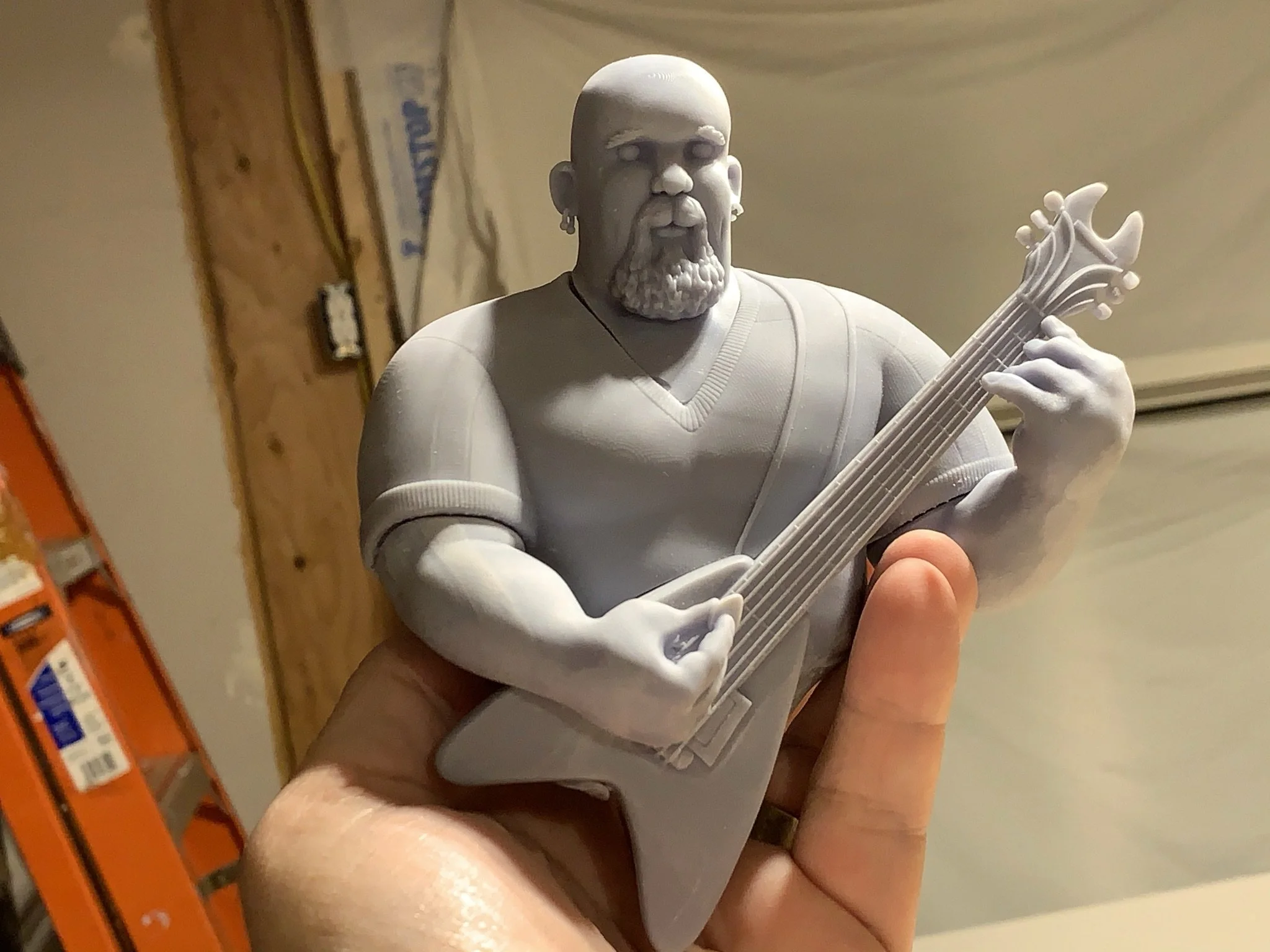 At the time, this was my most complicated parted build. I was so thrilled when the keyed resin printed parts (head, torso, left arm, right arm, and guitar) fit together post print. 