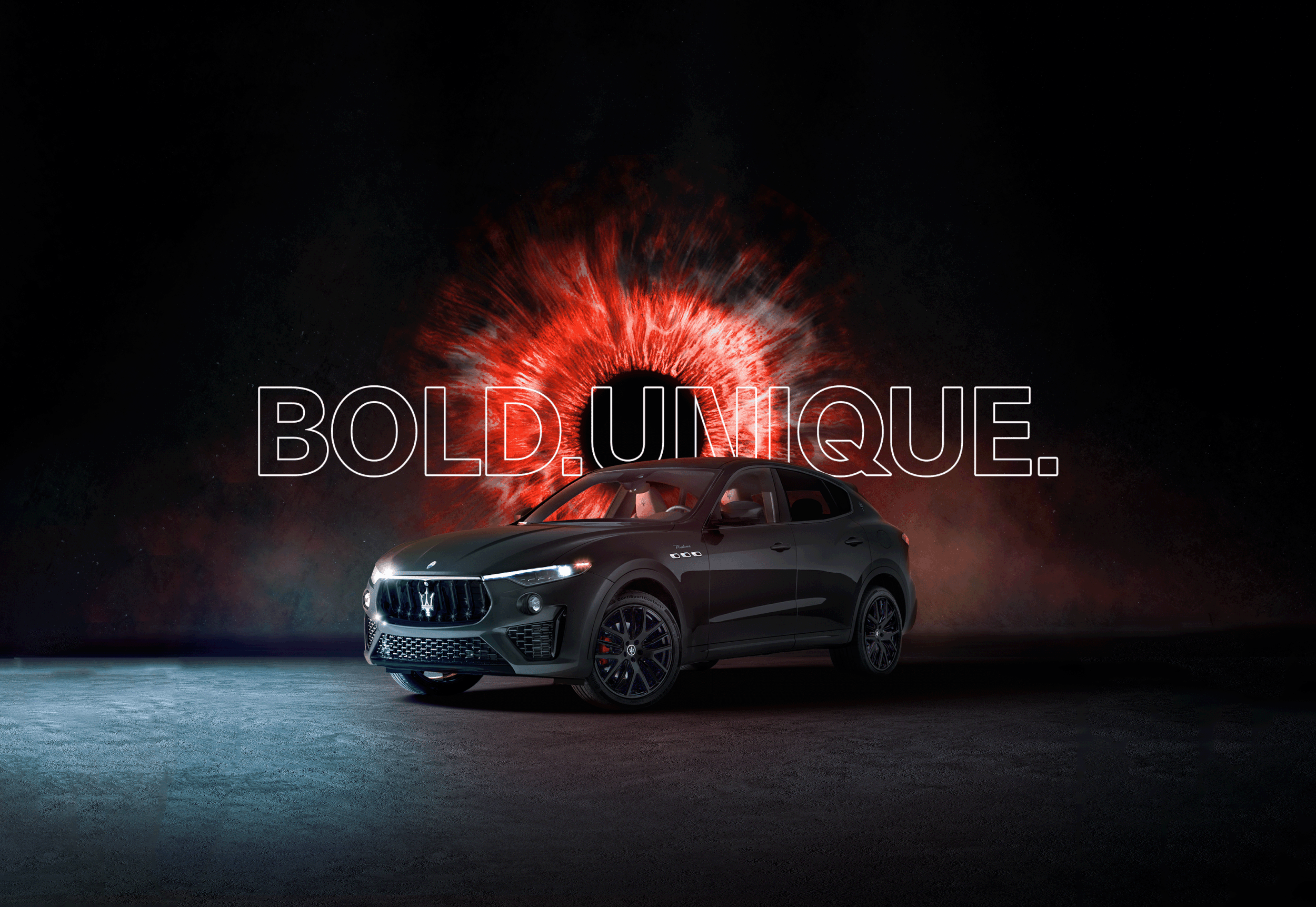 A black luxury SUV parked on a dark surface with a fiery red and black explosion behind it and the words "BOLD.UNIQUE." overlaid.