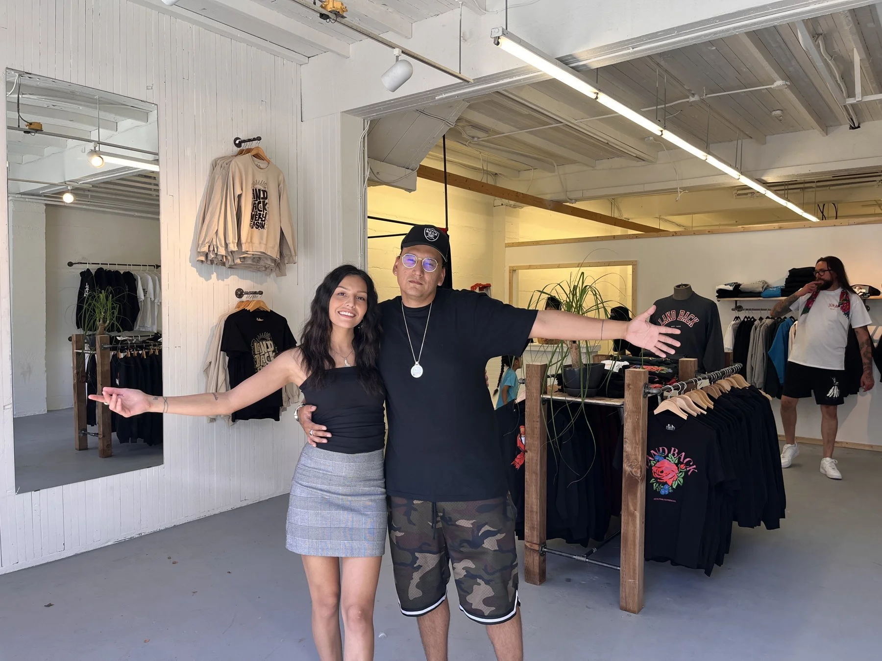 Dakota Bear and Casey Desjarlais welcoming customers inside the Decolonial Clothing flagship store on East Georgia Street, Vancouver