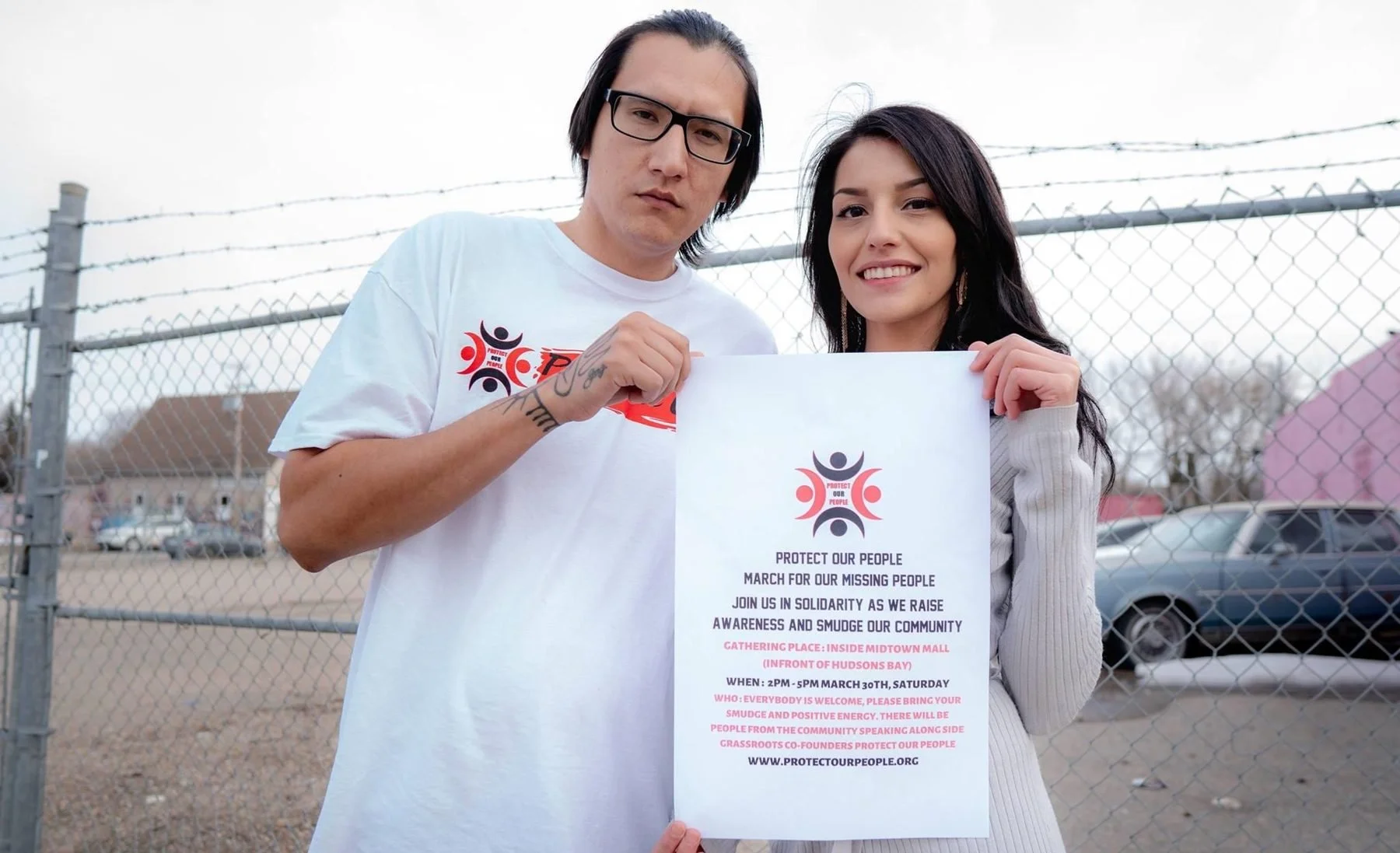 Dakota Bear and Casey Desjarlais, co-founders of Protect Our People, holding a flyer for their March for Our Missing People