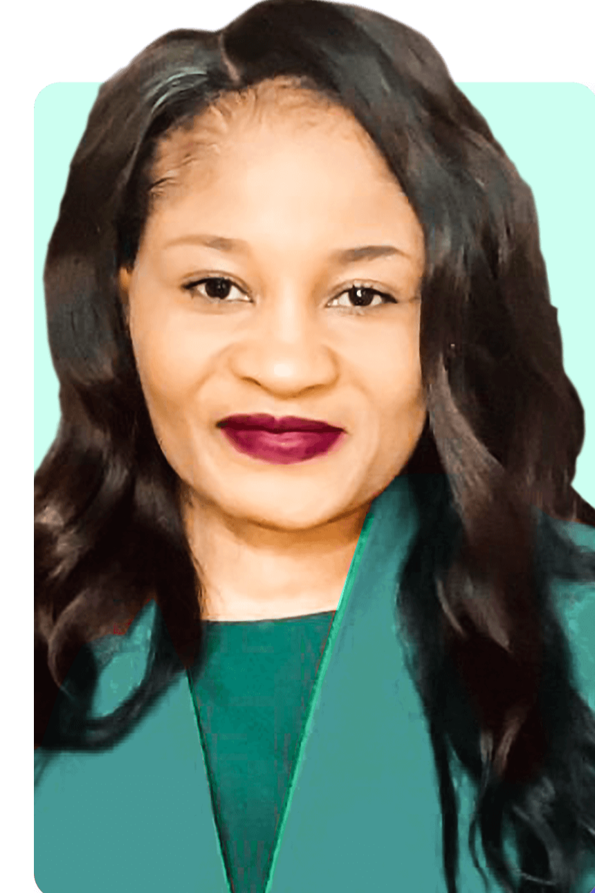 A woman with long, dark, curly hair, wearing a green outfit, and dark lipstick, smiling at the camera.