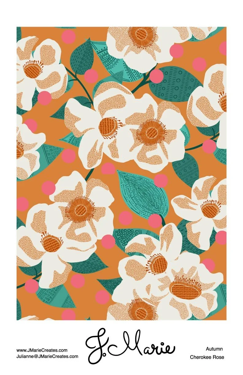 A floral pattern featuring white Cherokee roses with brown centers, green leaves, and pink dots on an orange background, with J. Marie signature and autumn Cherokee Rose label.