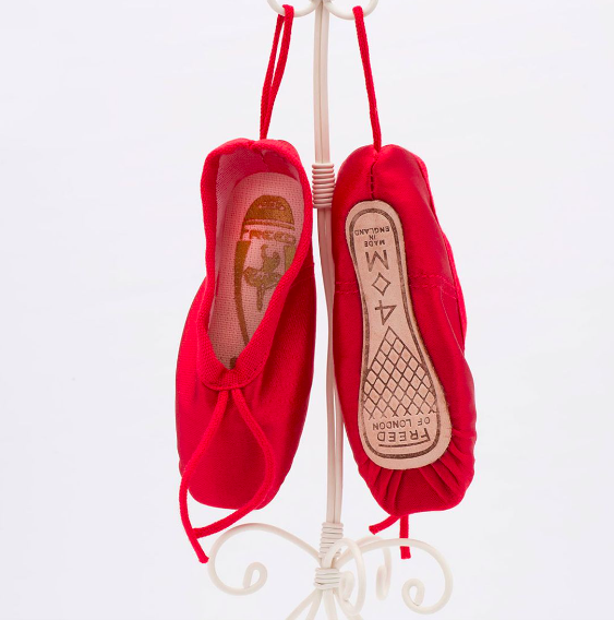 RED - The Freed mini pointe shoe gift set is a charming collection of petite-sized pointe shoes, perfect for ballet enthusiasts and collectors.