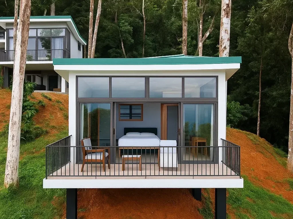 A modern house with a balcony, view of trees and nearby house in background.