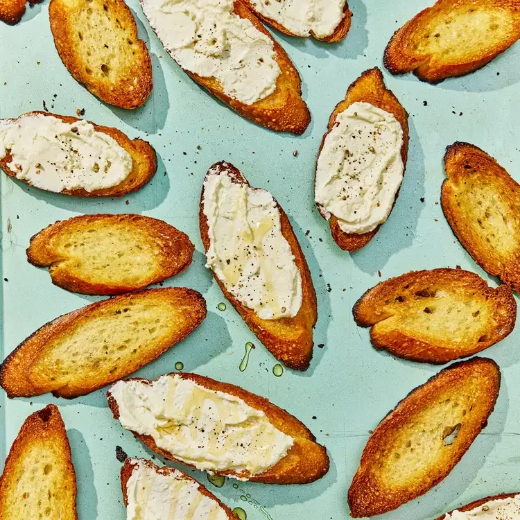 Pieces of toast with whipped feta and honey.