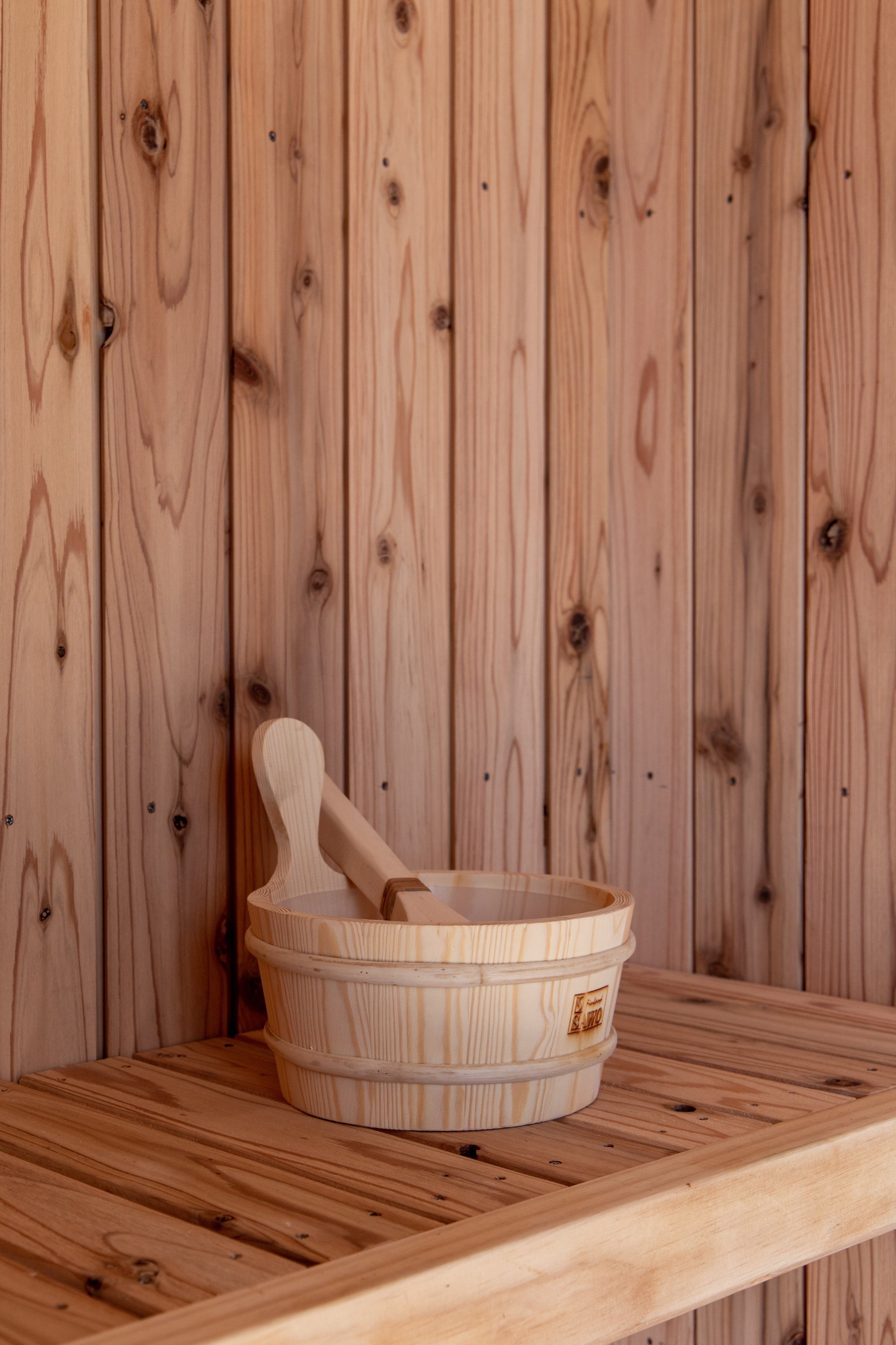 Japanese Sauna Interior with traditional water bucket and ladle