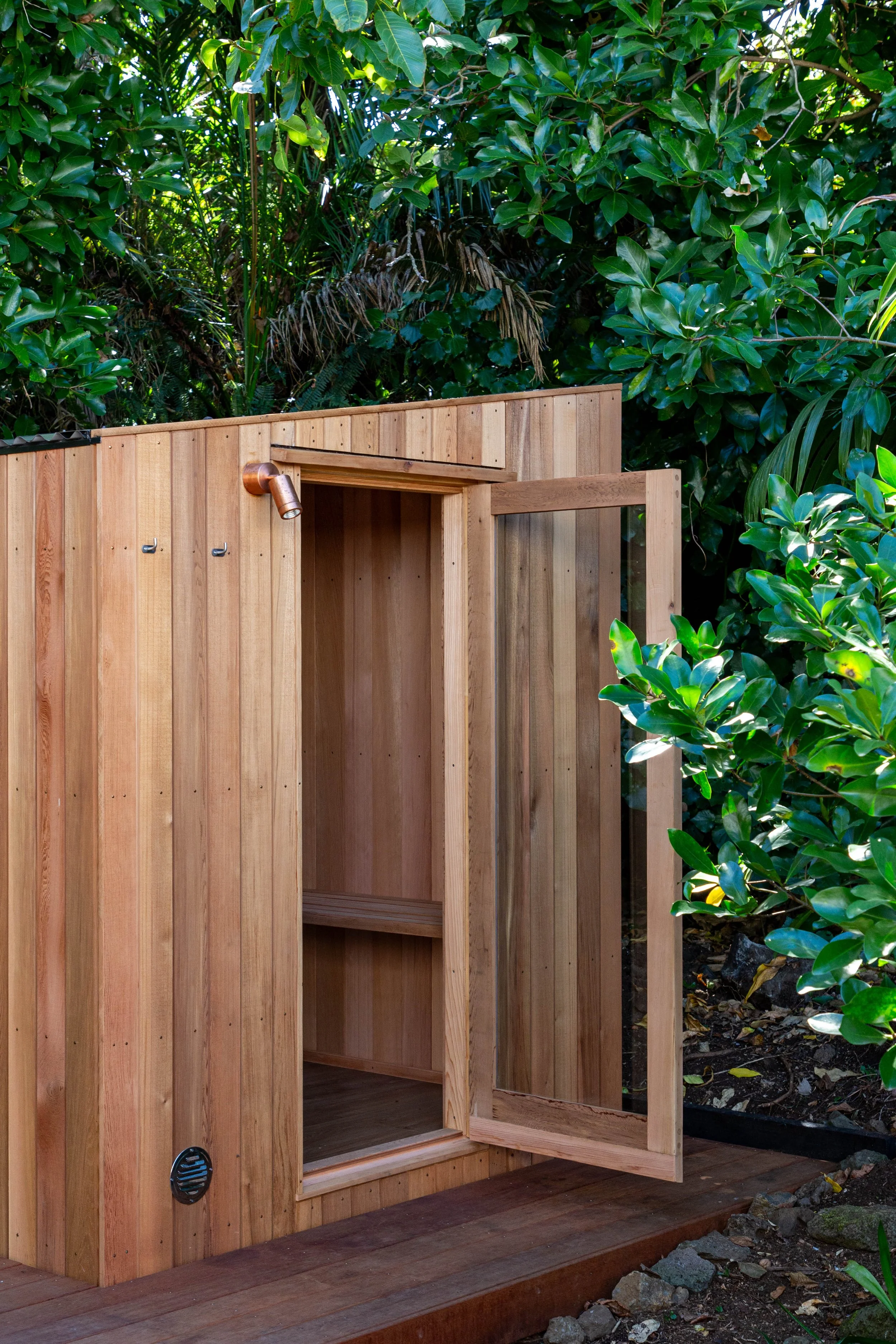 Garden Sauna with Cedar cladding nestled into Mount Eden Garden in Auckland