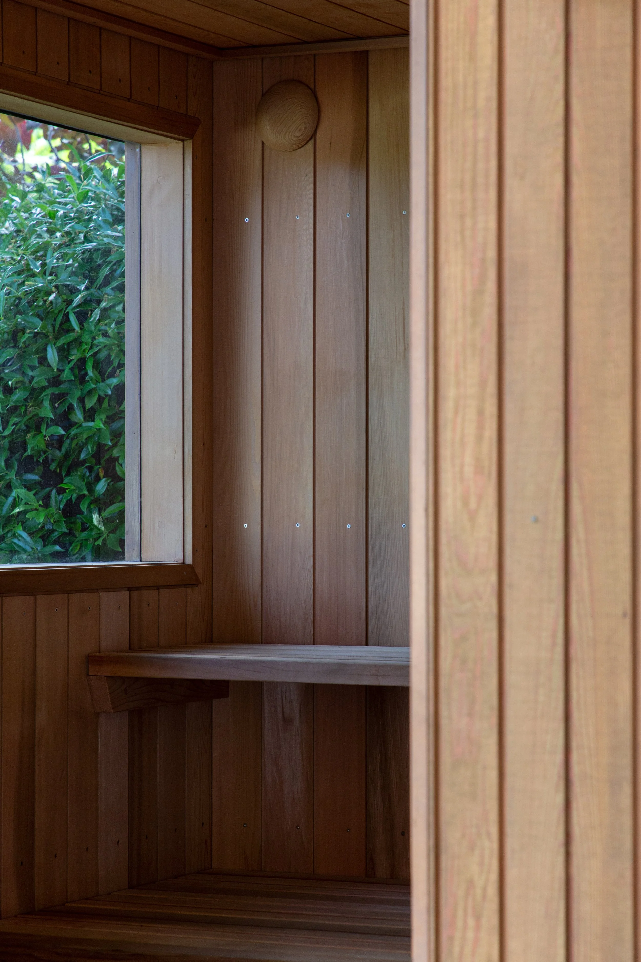 Cedar lined sauna with cedar cladding, similar profile to pool house stained with drydens oil