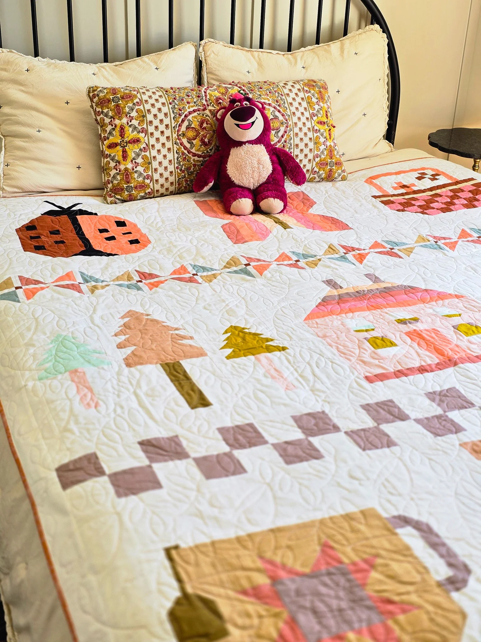 Cottage Garden quilt spreading on the bed