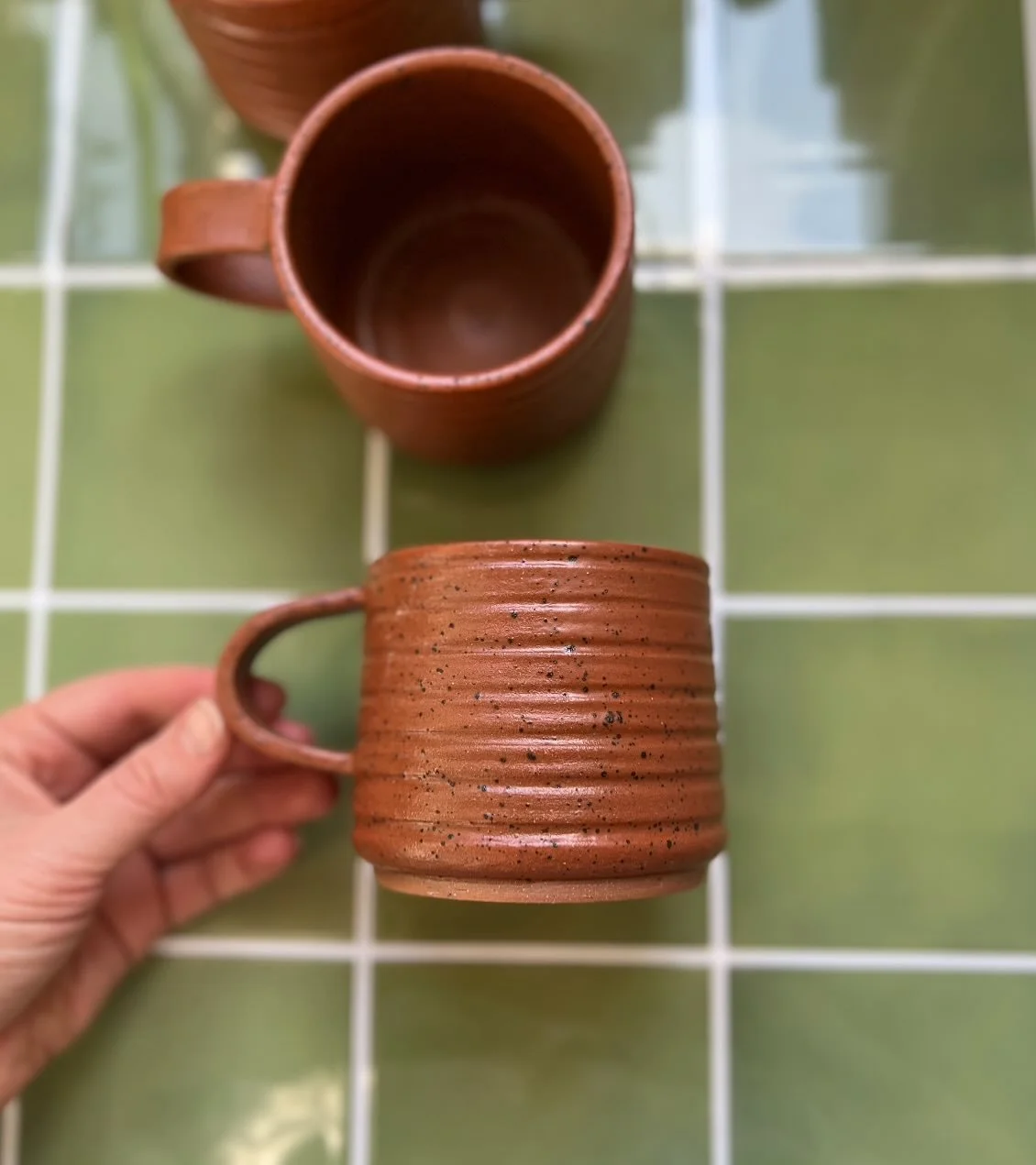 Ribbed sienna mugs are also available in the shop, just a few left
