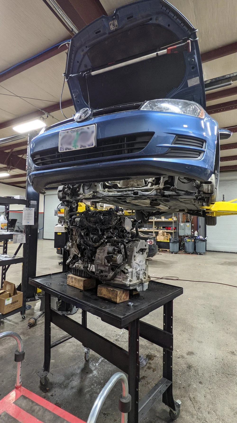 Volkswagen in the mechanics shop getting the motor removed in California, Oregon