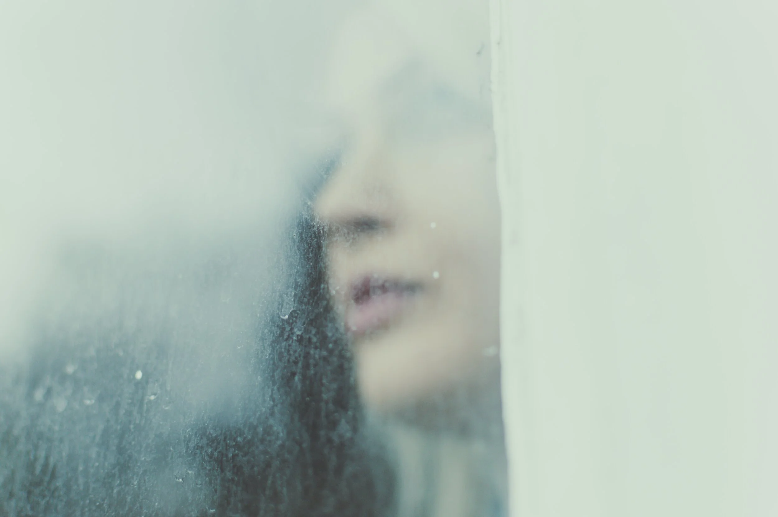 Womansfaceatwindow.jpg
