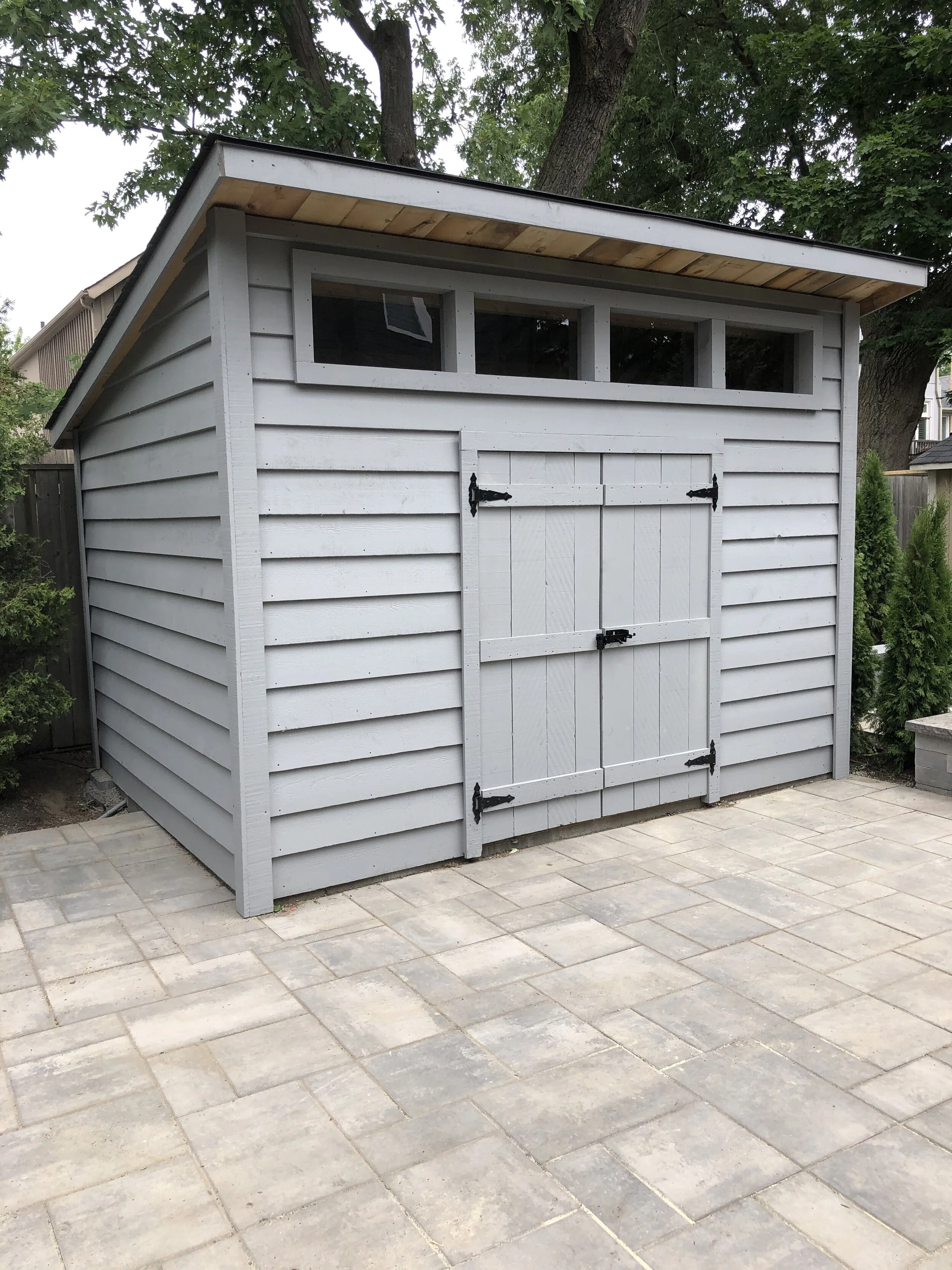 Shed:   
9x12 Lean-To (96" Eave) $6141 
 Options:   
2 x Extra windows $300  
2'x12' Overhang $720 
Double Doors $175 
 Total: $7336