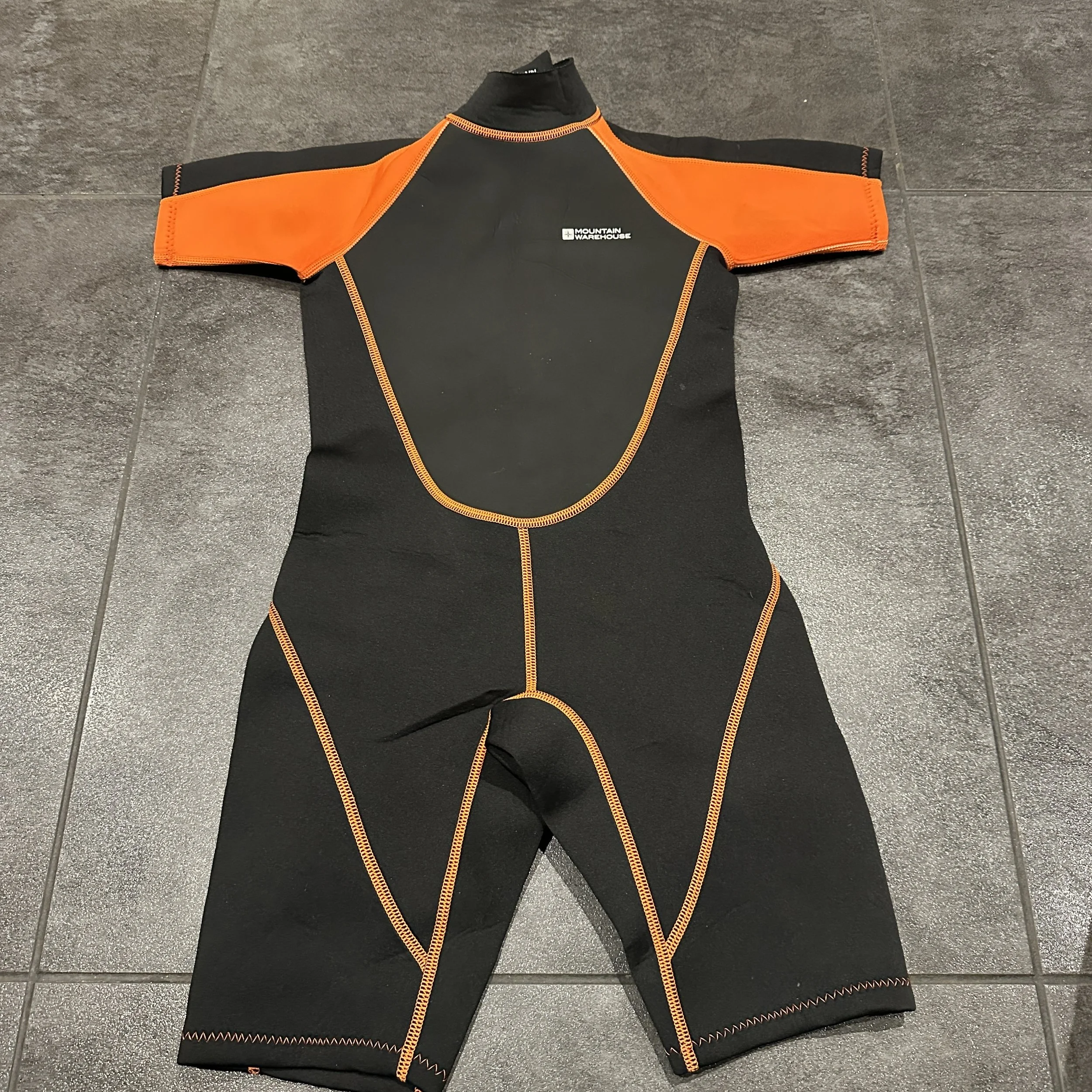 Item 39 -Mountain Warehouse shortie wetsuit size 9 - 10 years
