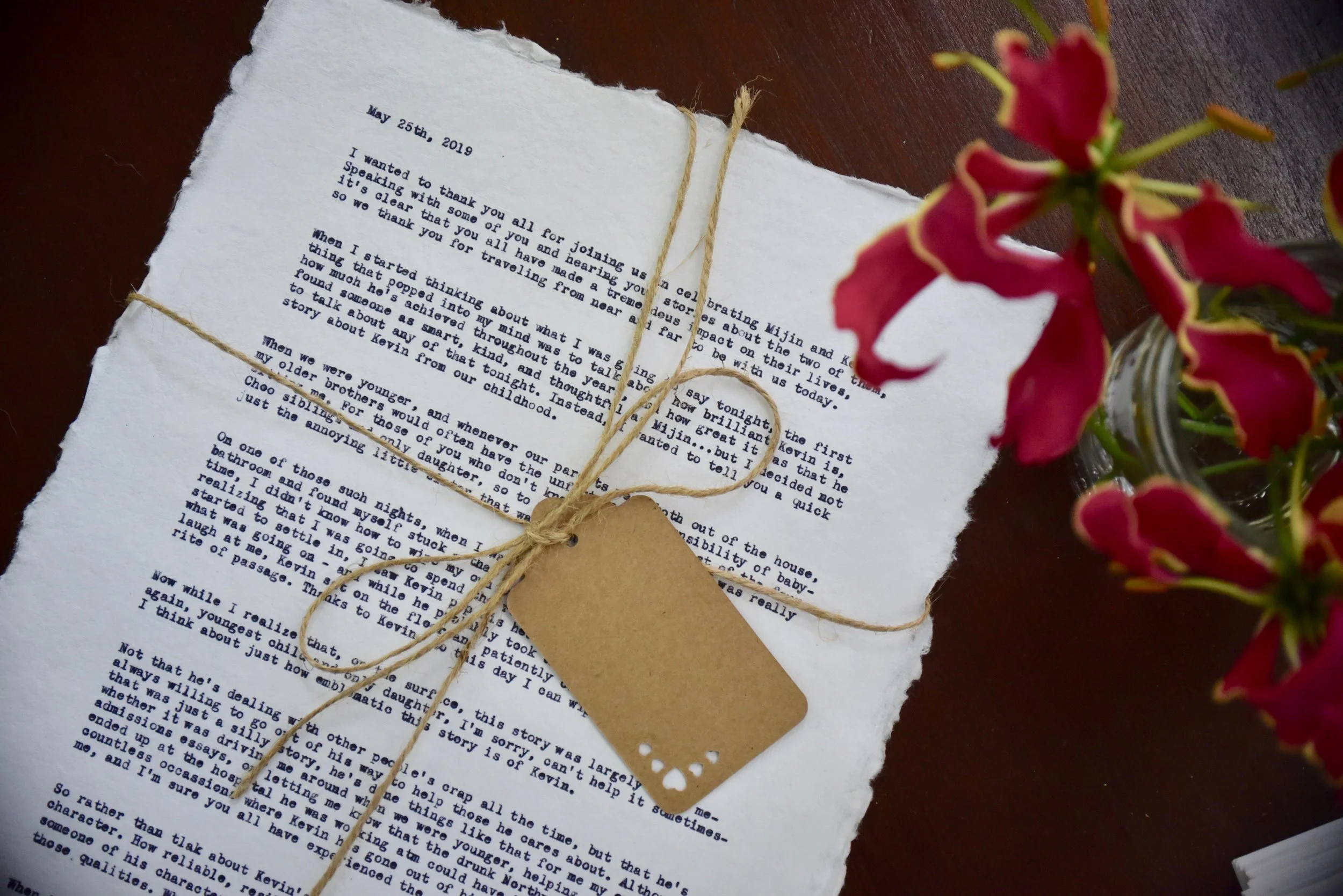 Close-up of hand typed wedding vows on cotton deckle paper with kraft tag - personalized 2nd anniversary cotton gift for couples