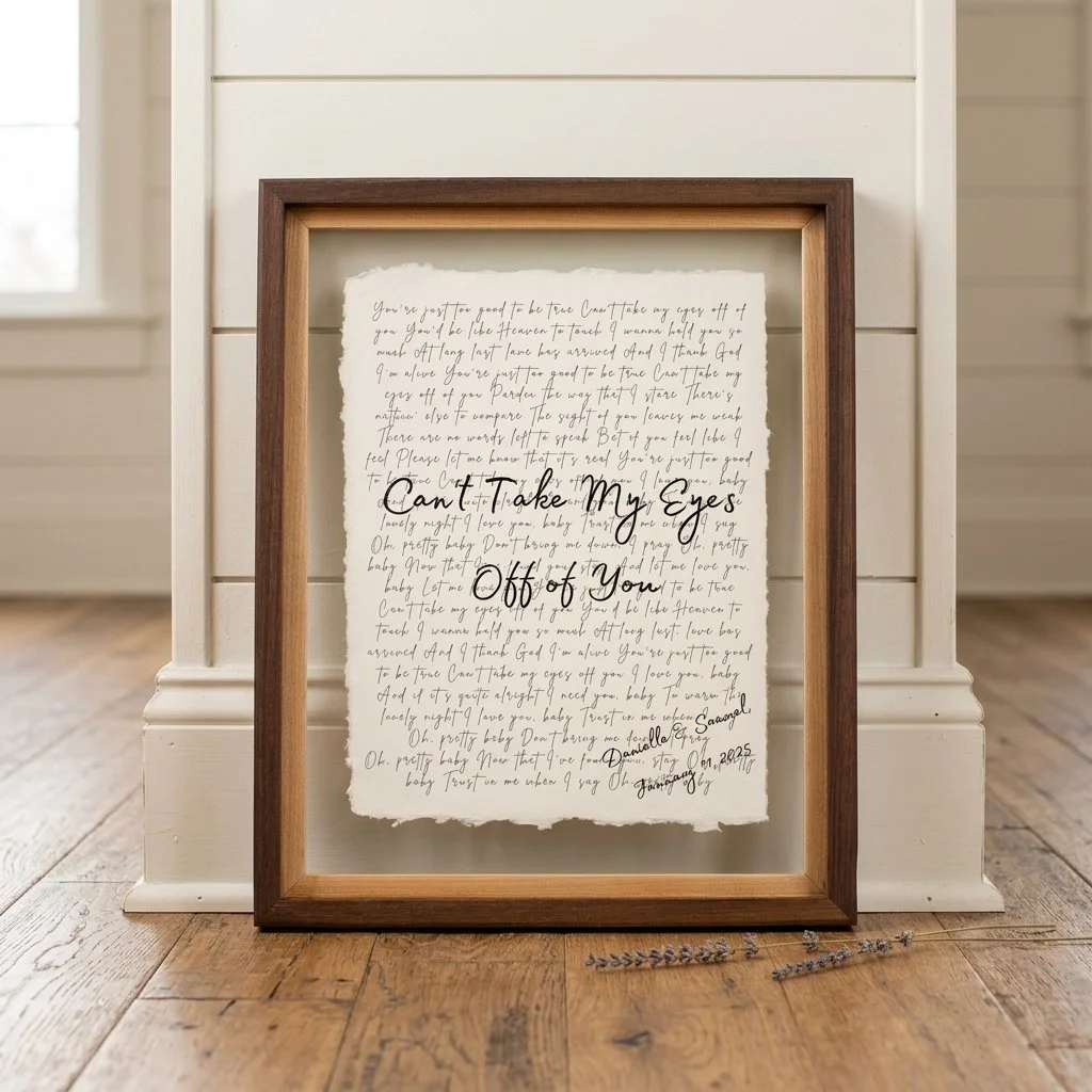 Personalized song lyrics on handmade cotton paper in a walnut float frame against white wall - custom cotton anniversary gift
