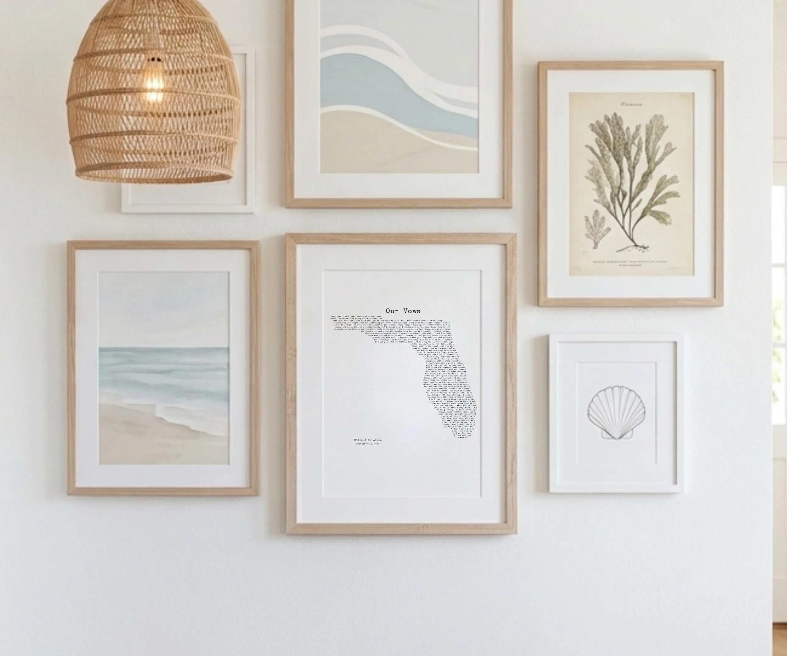 Framed Florida wedding vows print hung on a gallery wall with coastal artwork