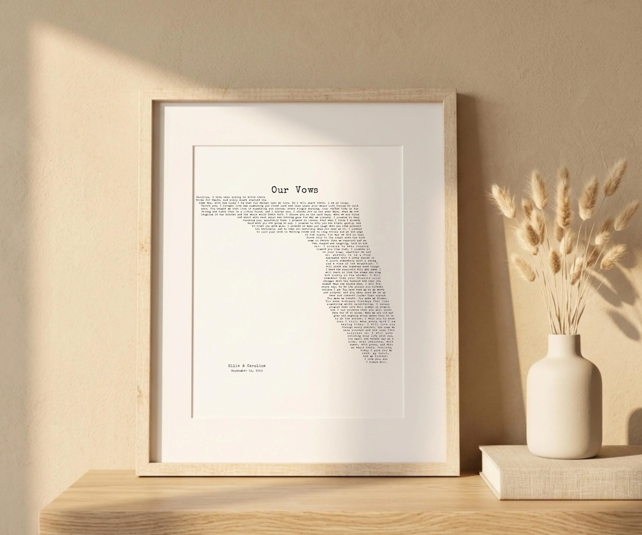Matted Florida state vows print in a light wood frame on a shelf with a vase of dried grasses