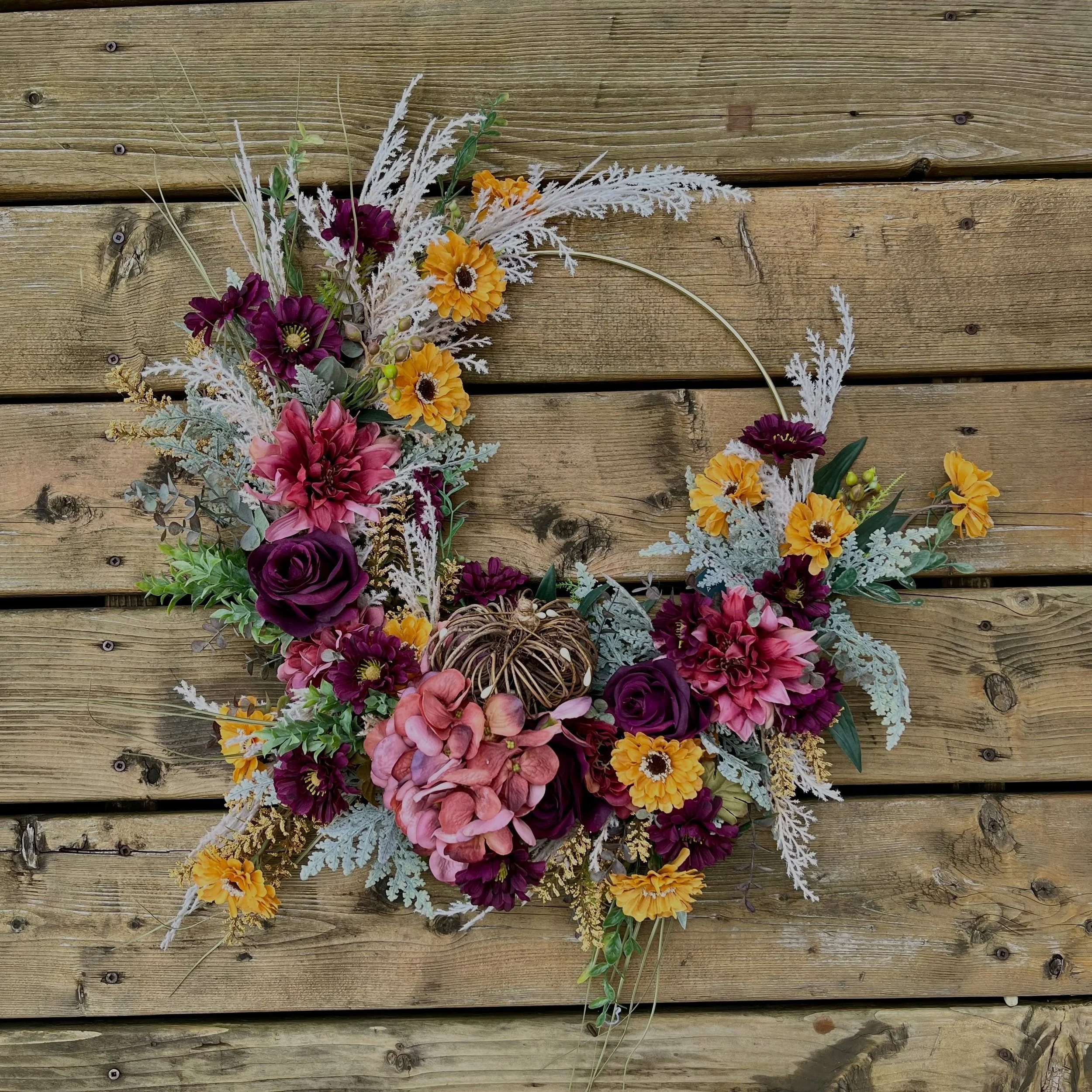 Back to school means it&rsquo;s officially Pumpkin season!  So we are starting strong with the Charlotte wreath - rich burgundy tones, deep yellow accented with faux pampas and a very subtle grapevine pumpkin.